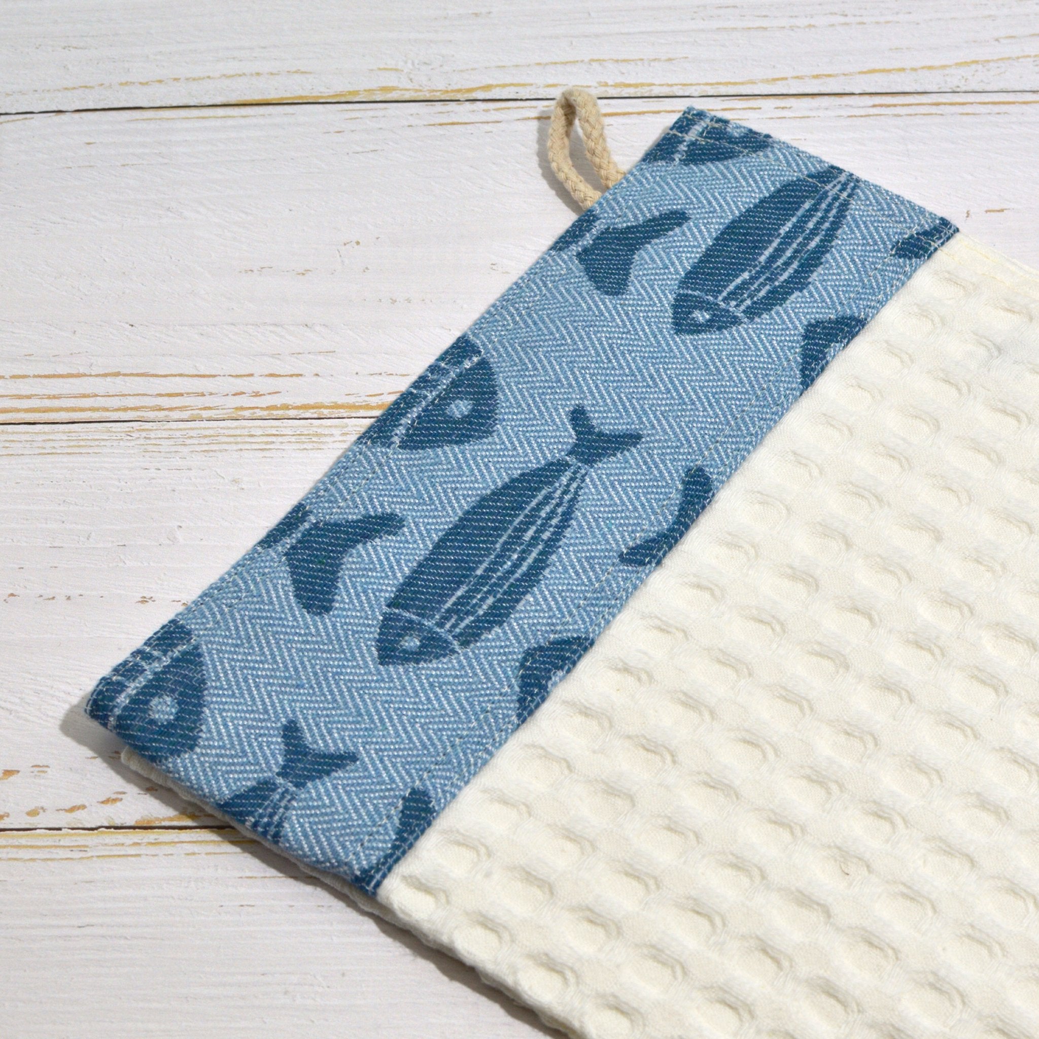 Colorful Italian-made kitchen towel with fish design, made of soft linen, perfect for kitchen decor and table linens.