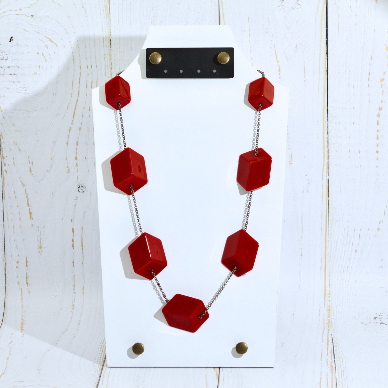 Handcrafted Italian jewelry set with red Cubi earrings and matching necklace, featuring modern geometric design.