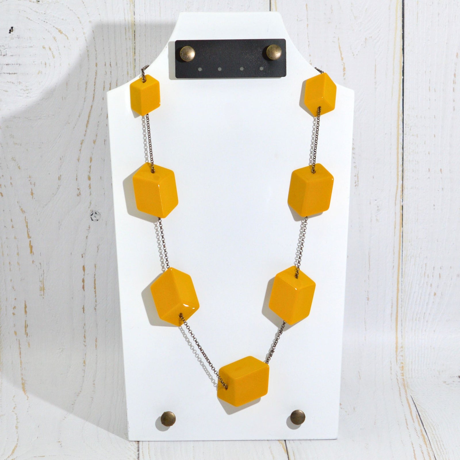 Handcrafted Italian jewelry set with red Cubi earrings and matching necklace, featuring modern geometric design.