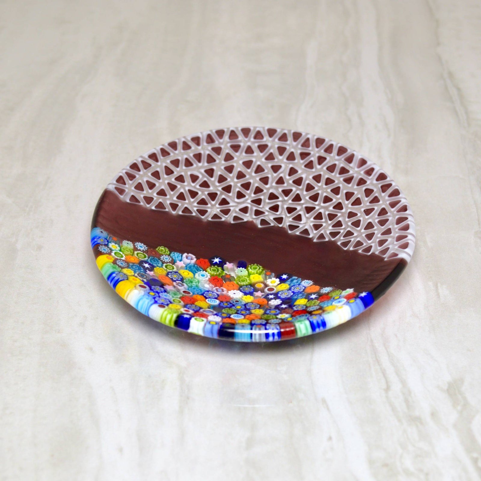 Round Murano glass Luca dish with millefiori pattern, violet color, artist signed, decorative tray for display or serving.