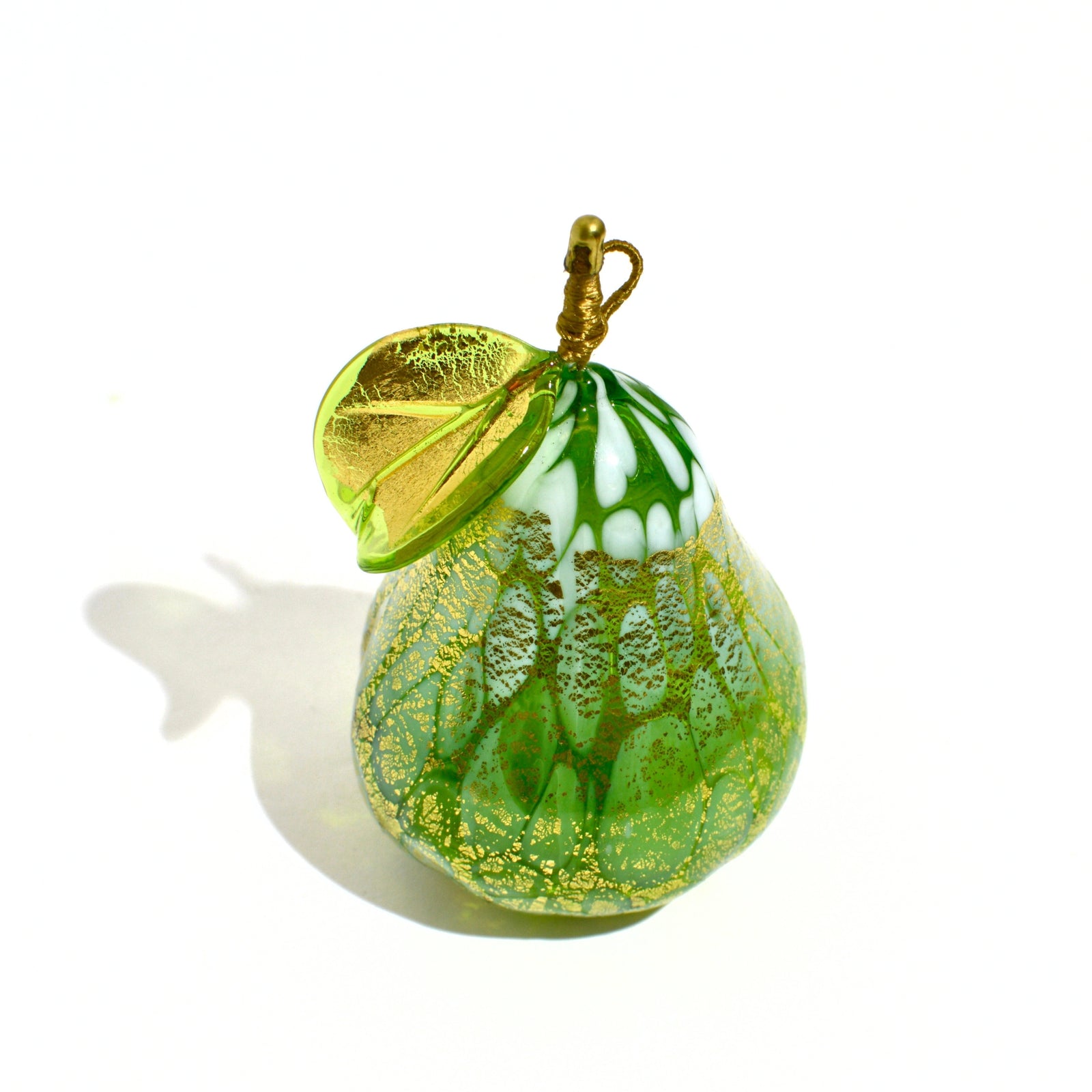 Hand-blown Murano glass Macchia pear with gold foil, Italian artificial floral decor by My Italian Decor displayed on a plate.