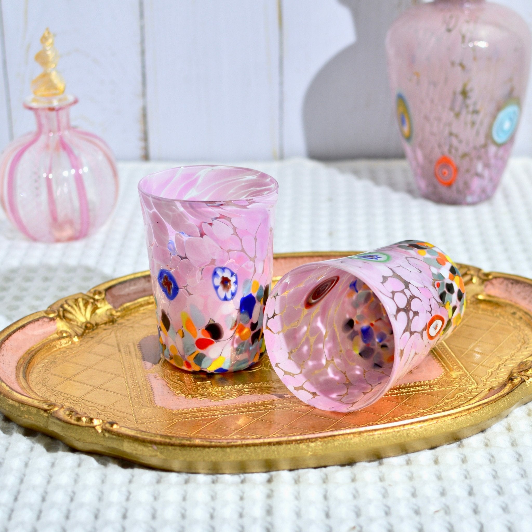 Pink Medici Murano glass tumbler with Millefiori design, showcasing vibrant floral patterns and craftsmanship.