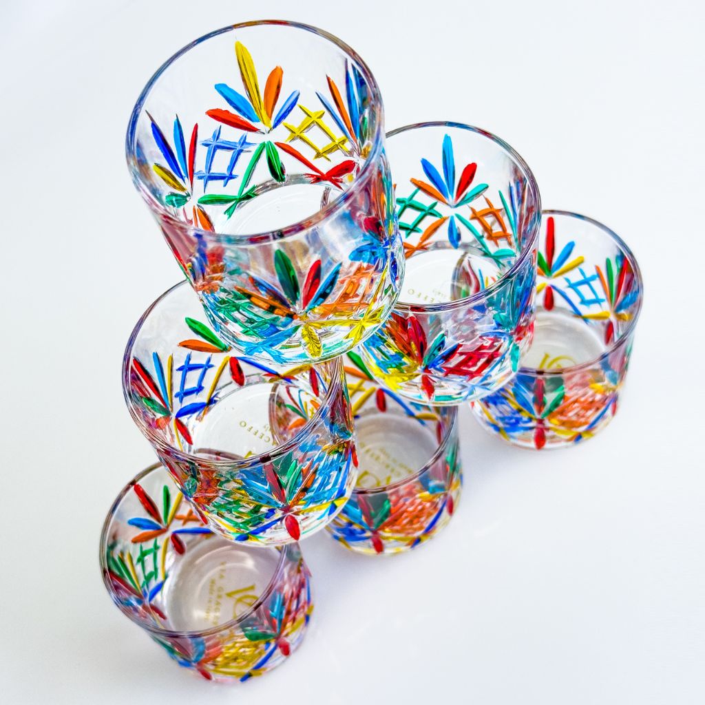 Set of six Italian crystal shot glasses by DZ, Melodia collection, showcasing elegant, clear glass with intricate design details.