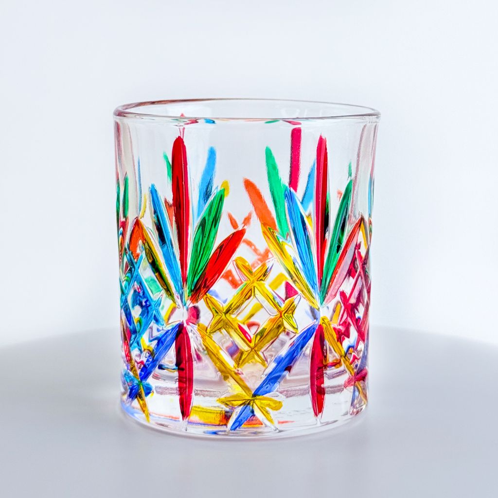 Set of four DZ Italian hand-painted crystal cocktail tumblers with colorful, assorted designs on clear glass.