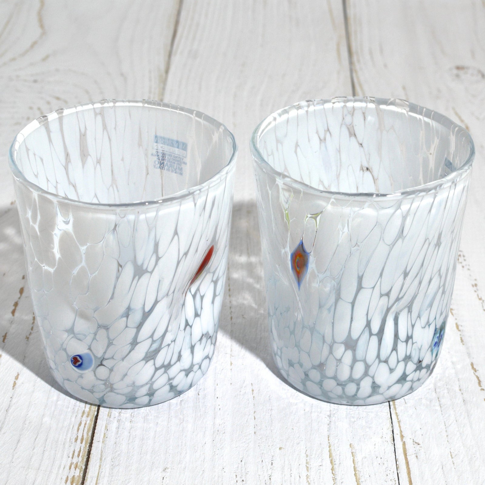 Set of 2 Murano glass tumblers by Franco Bianco, featuring white and Millefiori designs, perfect for elegant drinkware.