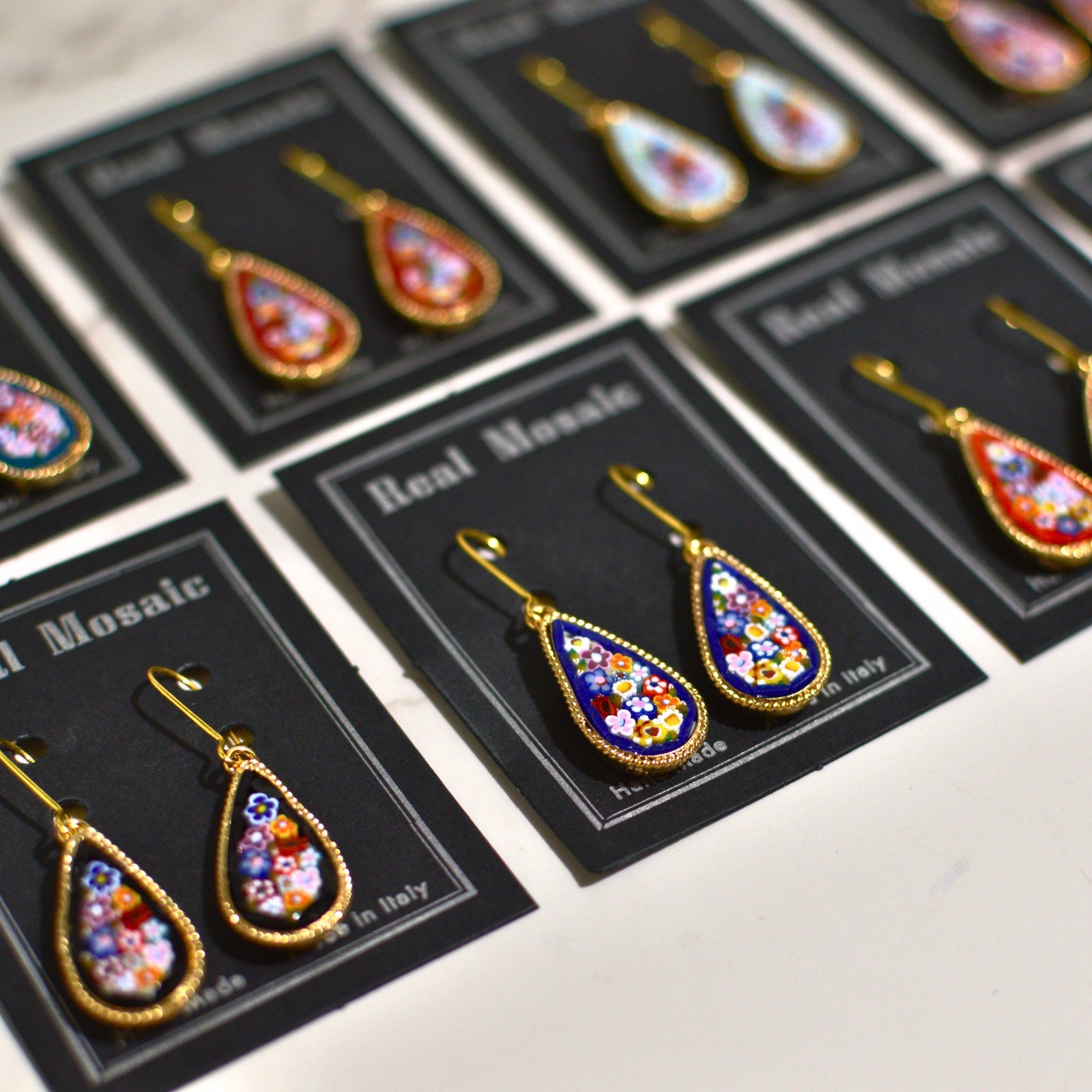Large teardrop Florentine mosaic earrings with millefiori design, made in Italy, featuring vibrant cobalt blue colors.