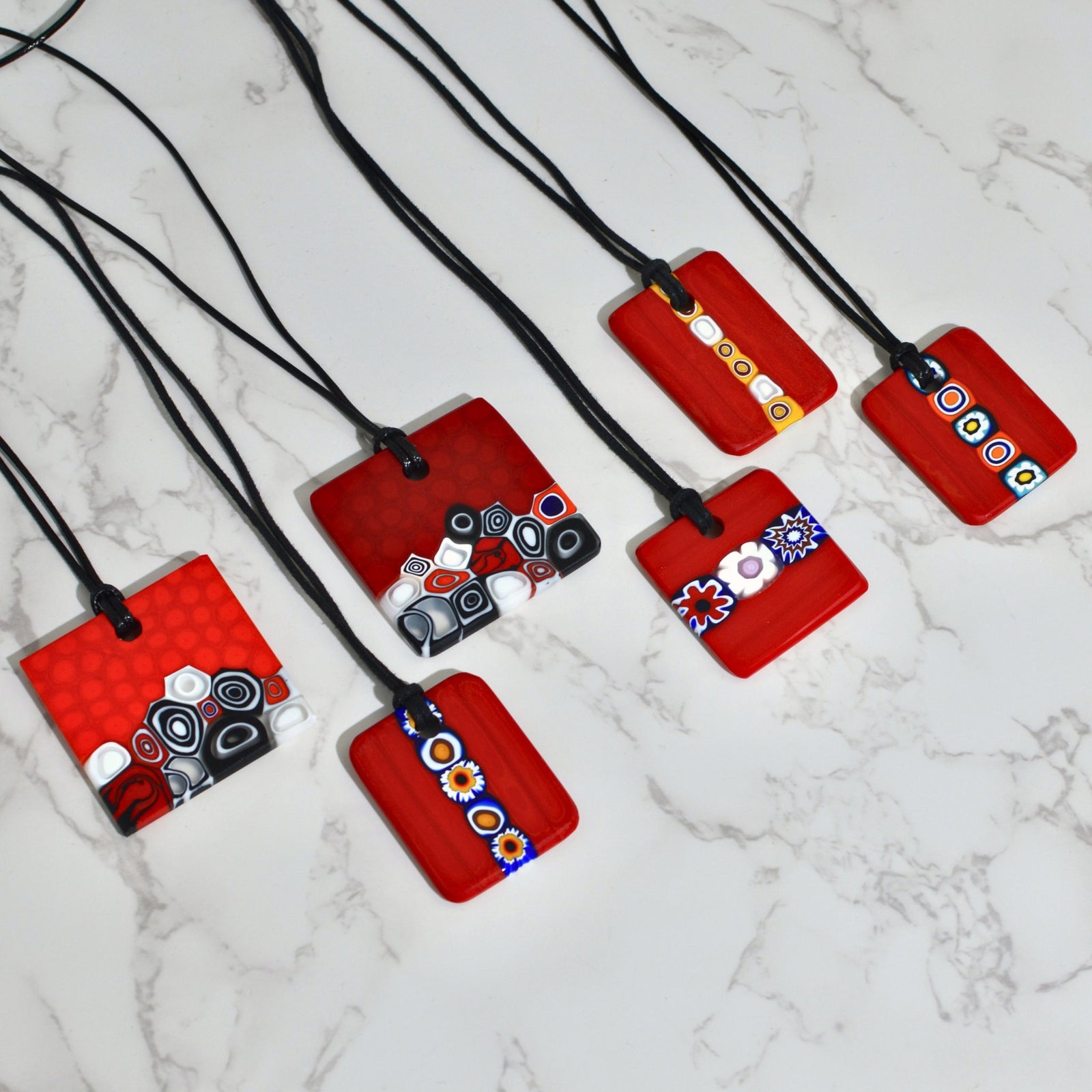 Red Millefiori glass pendant necklace with charms, made in Italy, featuring intricate colorful glass designs by My Italian Decor.