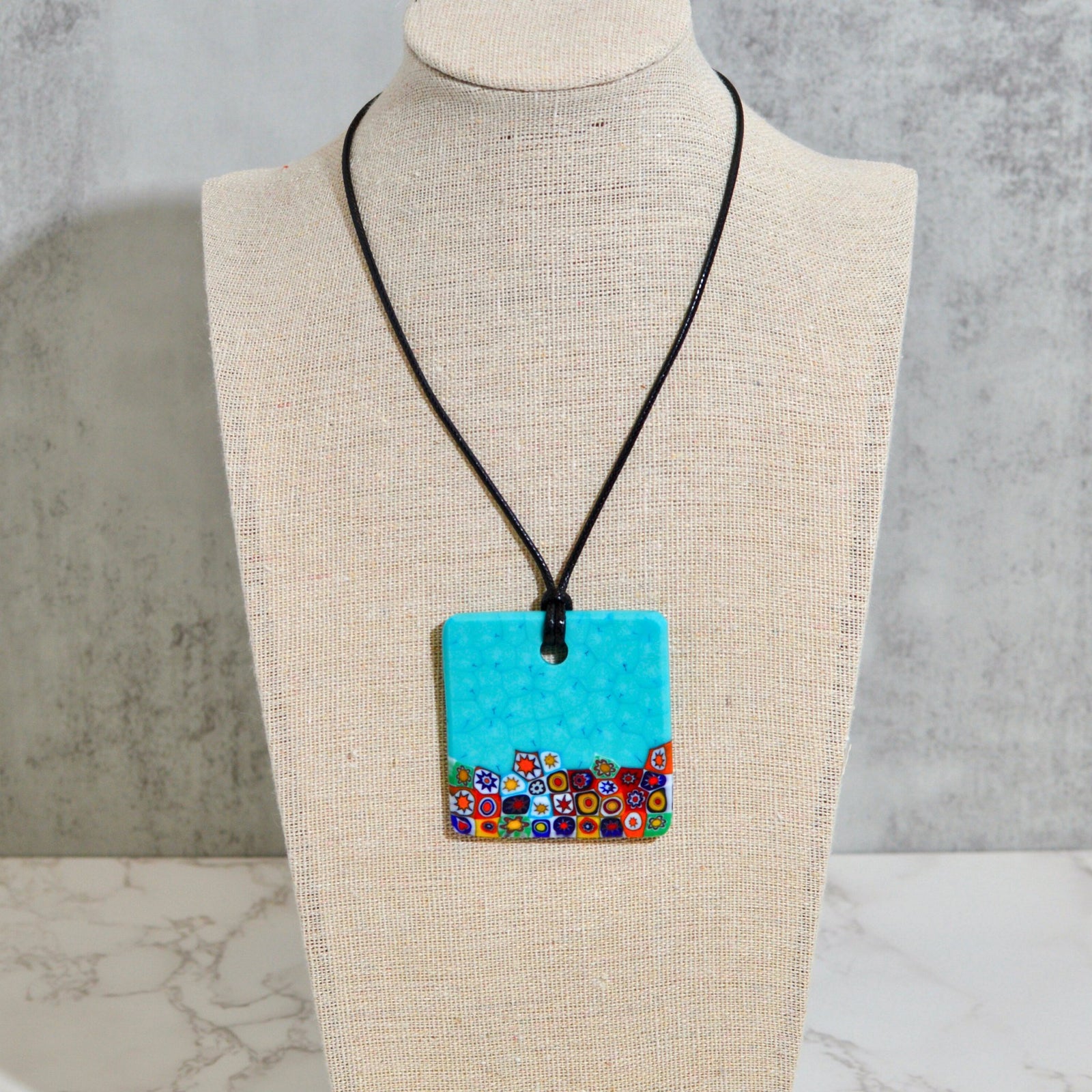 Square teal Millefiori Aqua glass pendant necklace by My Italian Decor, showcasing colorful, handcrafted Italian charms and pendant design.