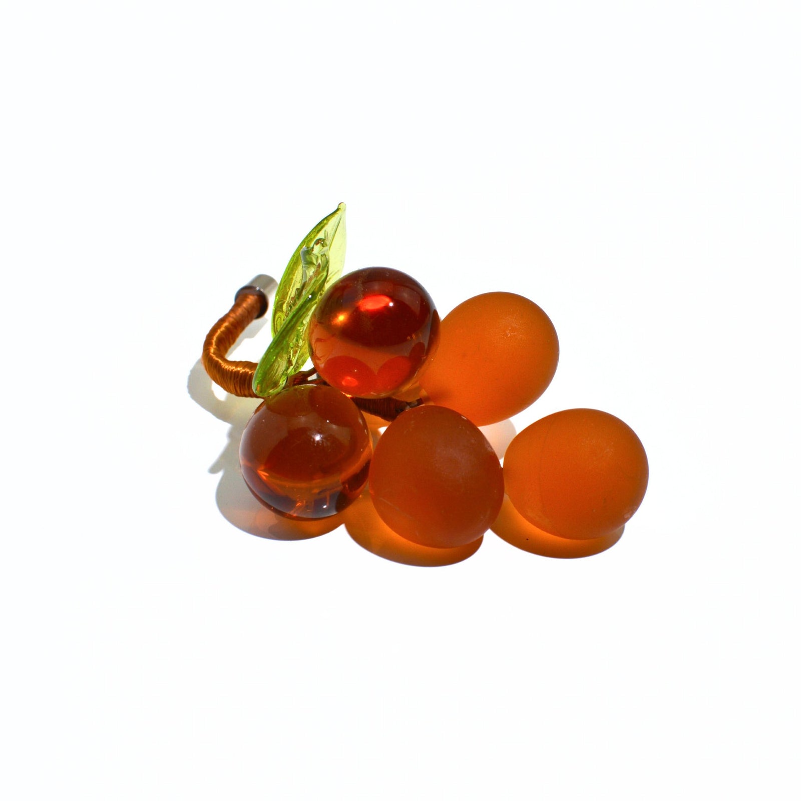 Mini Murano glass grape cluster in multiple colors, made in Italy, artificial floral decoration displayed in a bowl.