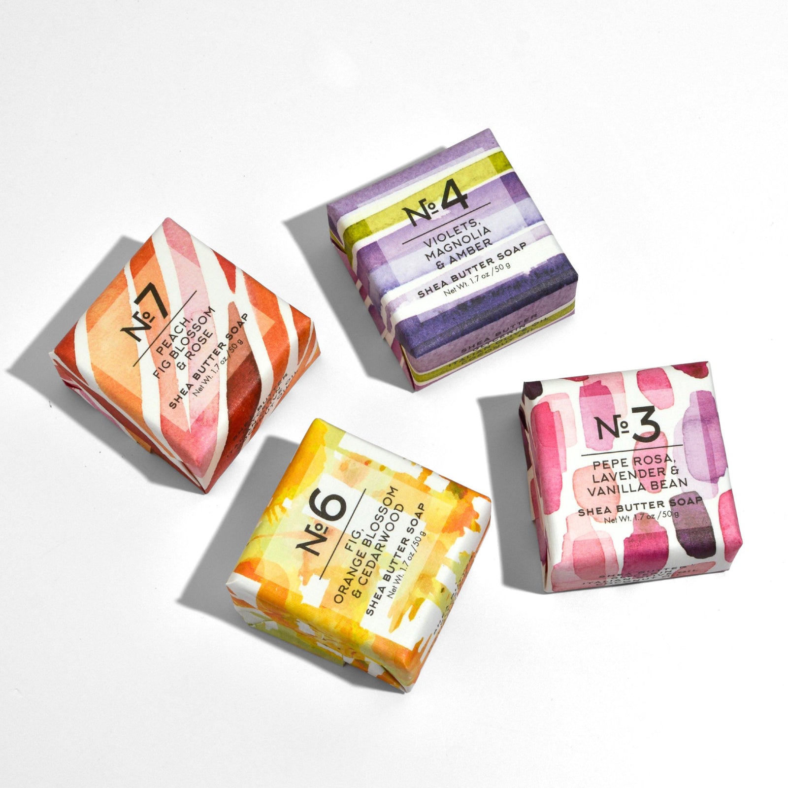 My Italian Decor Via Mercato Mini Soap Assortment featuring violet-scented bar soaps held in hand.