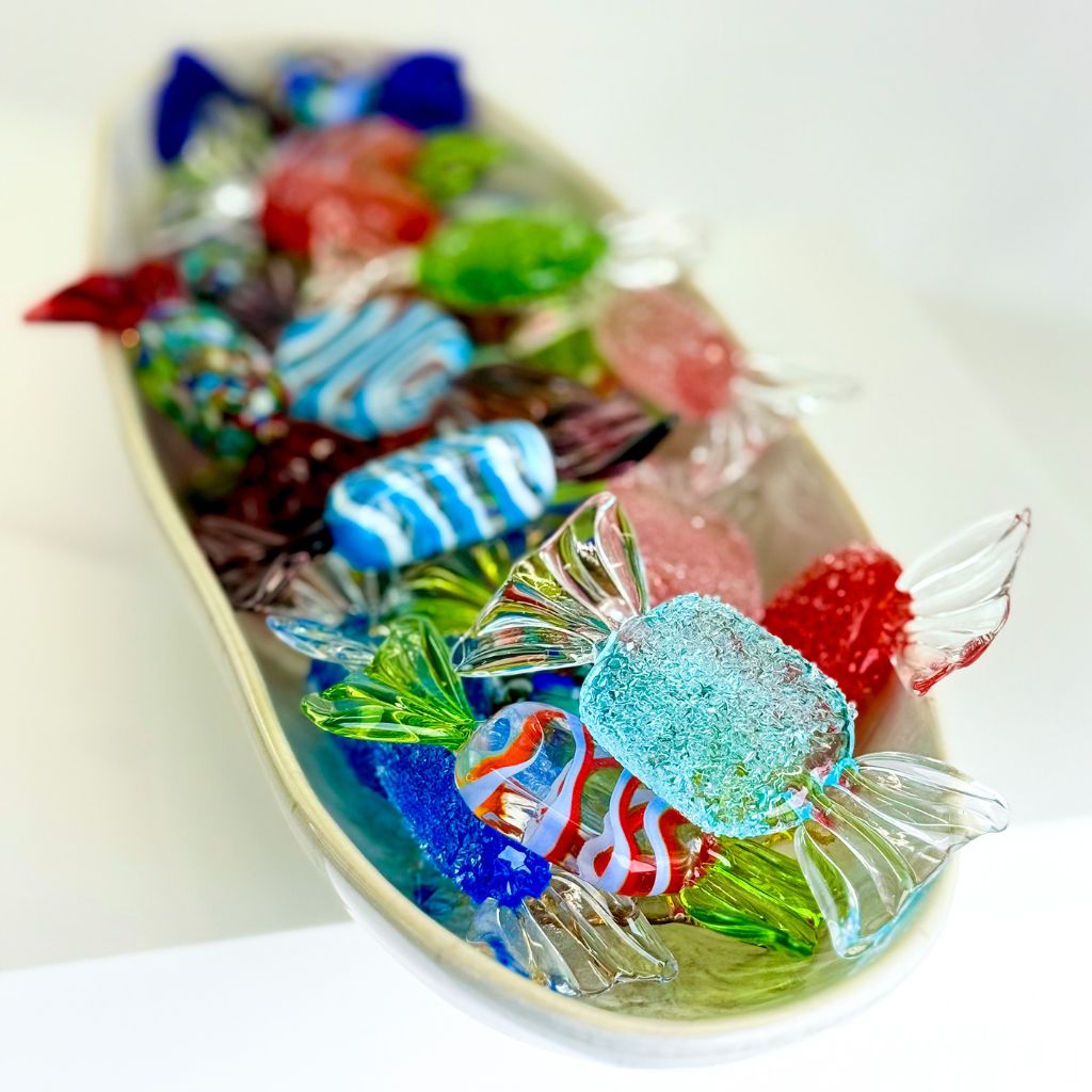 Assorted colorful candies on a white plate