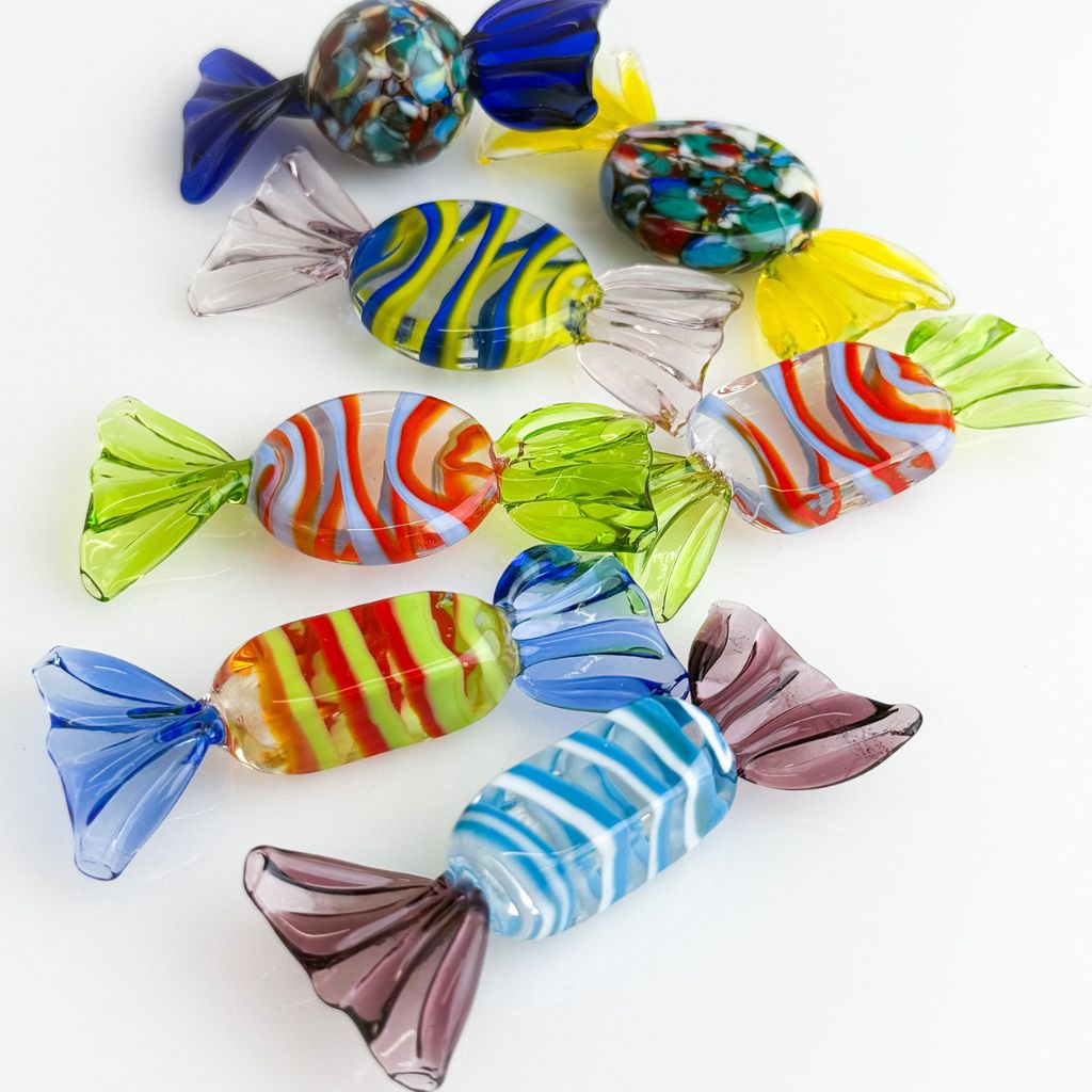 Colorful glass candies on a white background