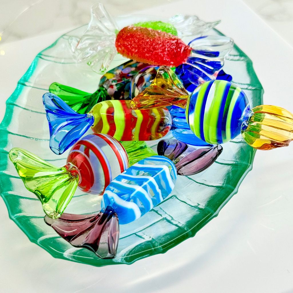 Colorful glass candy on a white plate