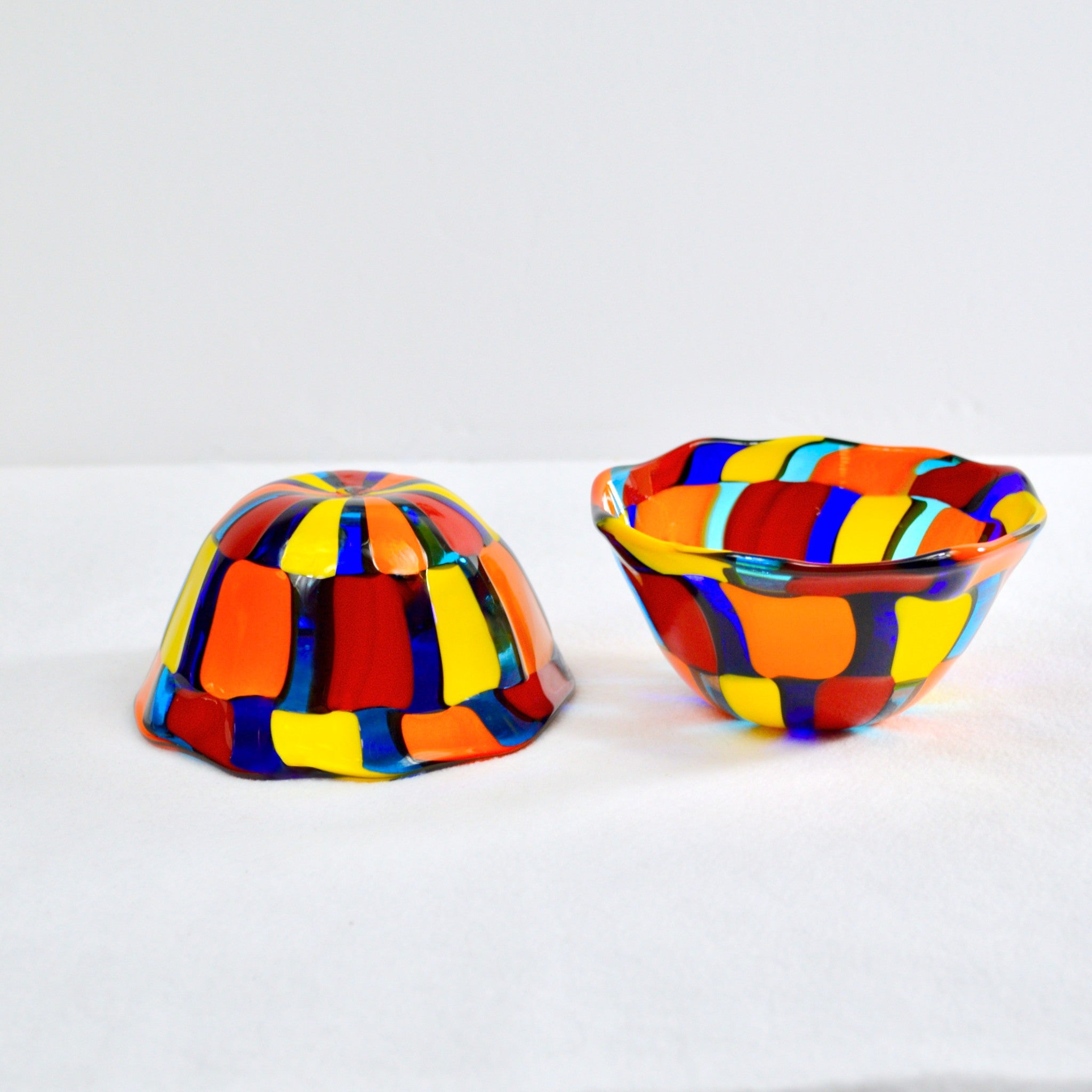 Two handblown murano glass bowls. on white background
