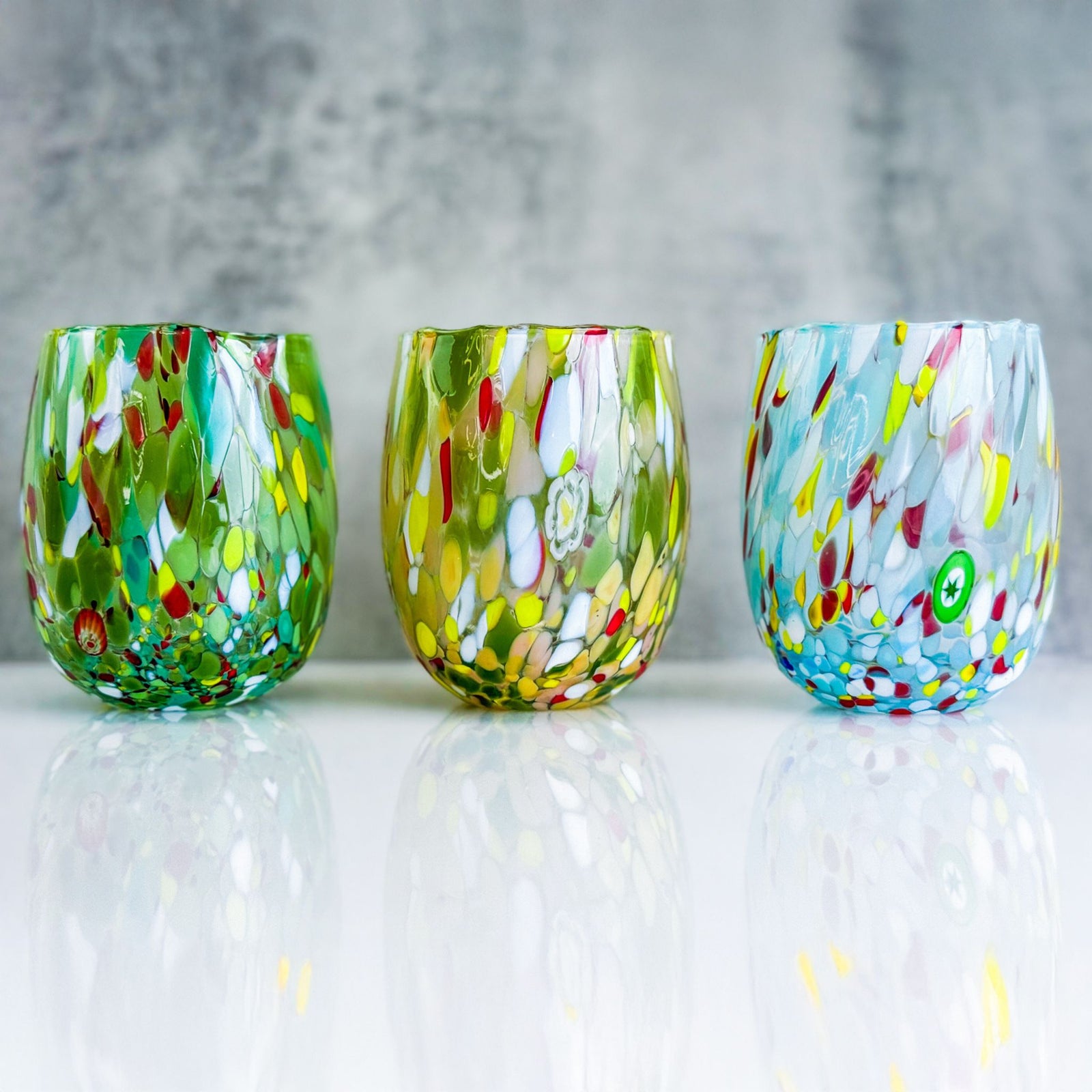 Set of 6 Guiliana Murano glass tumblers with elegant shape and clear design, made in Italy for stylish drinking.