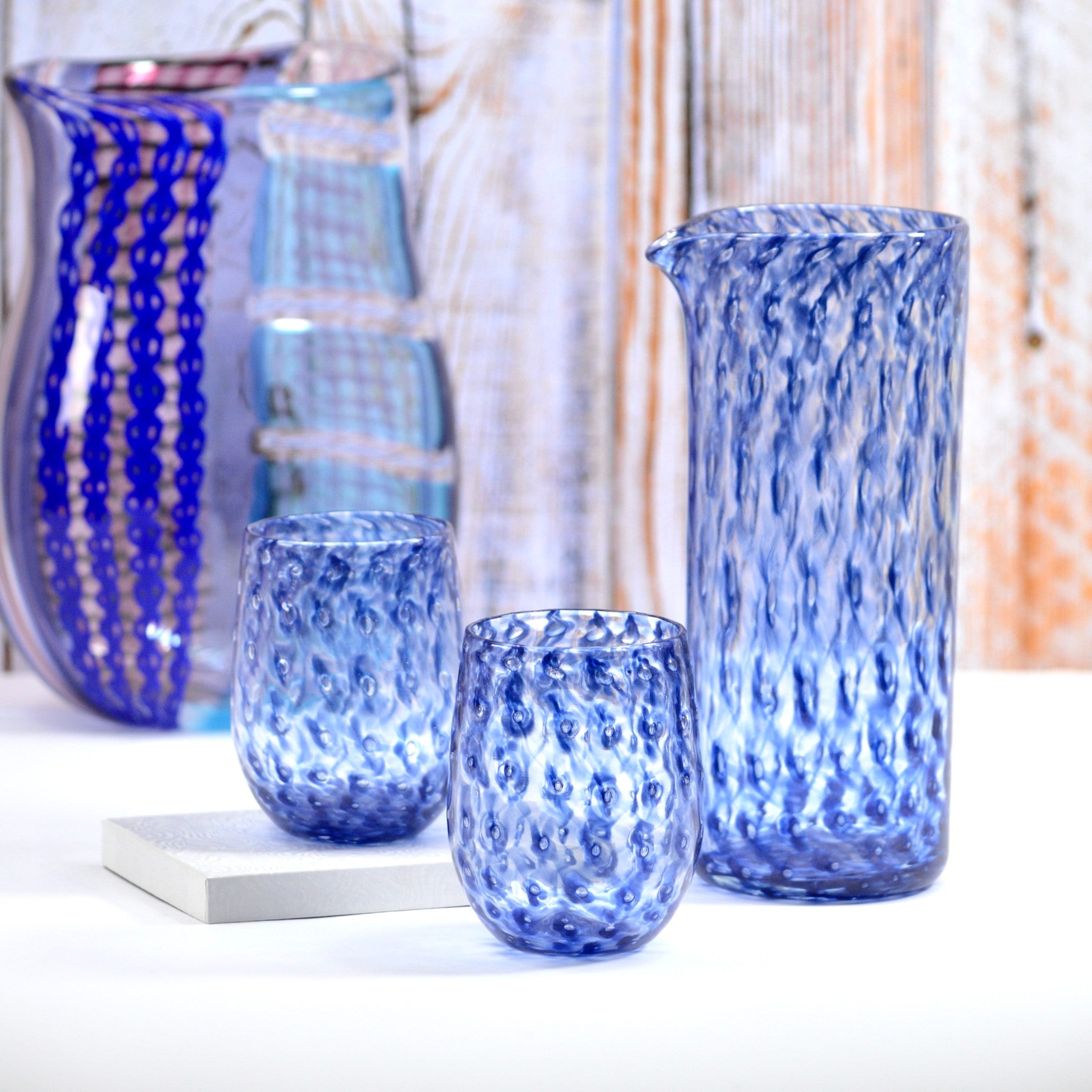 https://myitaliandecor.com/cdn/shop/files/nebbia-cobalt-blue-pitcher-glasses-set-glass-vase_2048x.jpg?v=1696957034