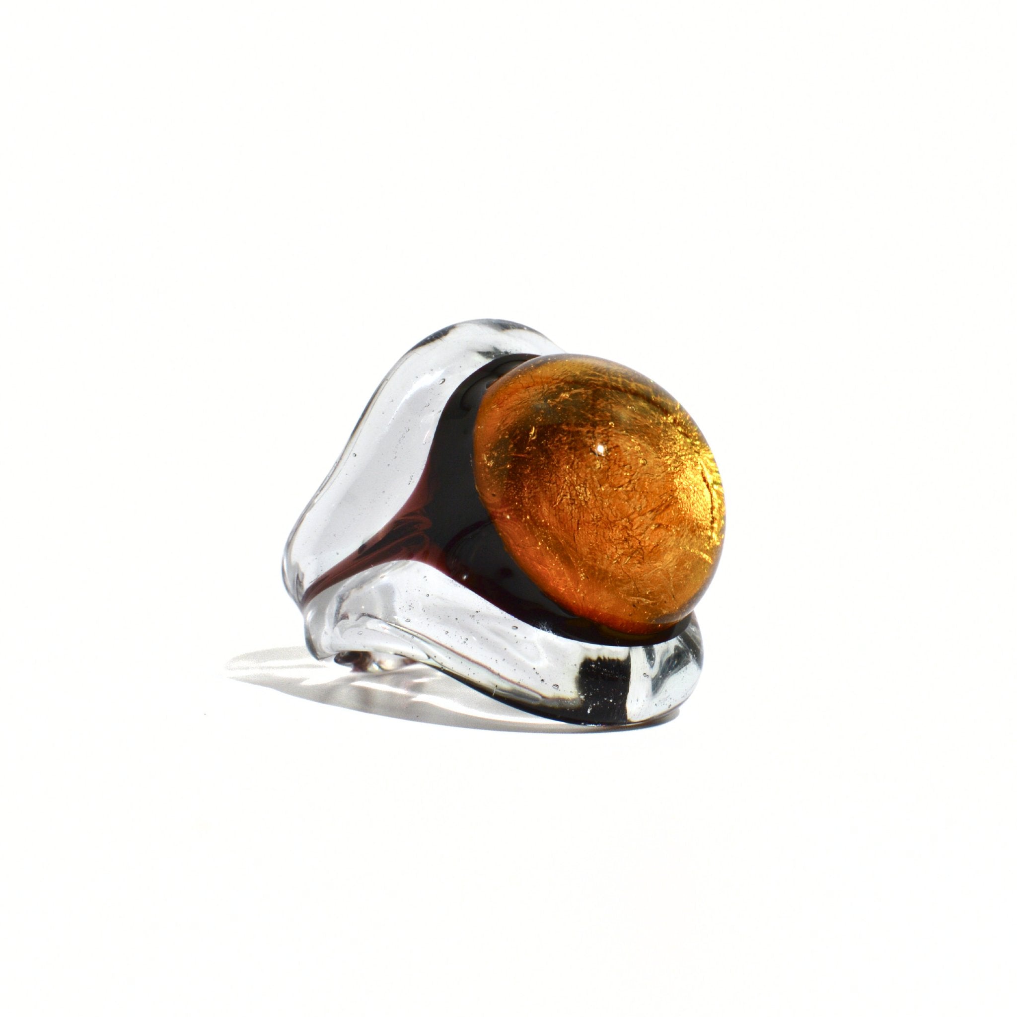 Close-up of amber Murano Glass Occhio Statement Ring by MyItalianDecor, showcasing intricate glass craftsmanship and vibrant color.
