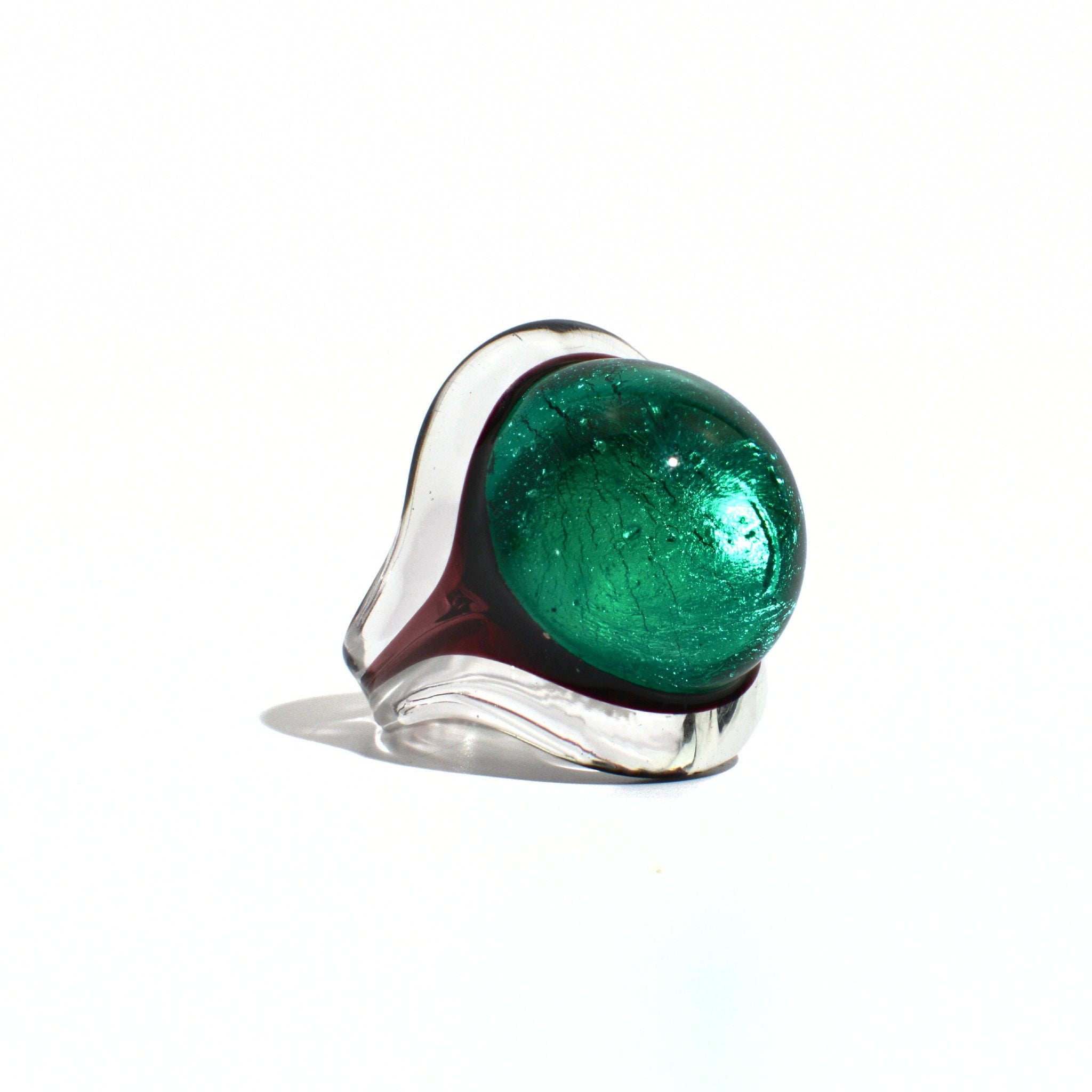 Close-up of green Murano glass Occhio statement ring by MyItalianDecor, showcasing vibrant glass craftsmanship and intricate design.