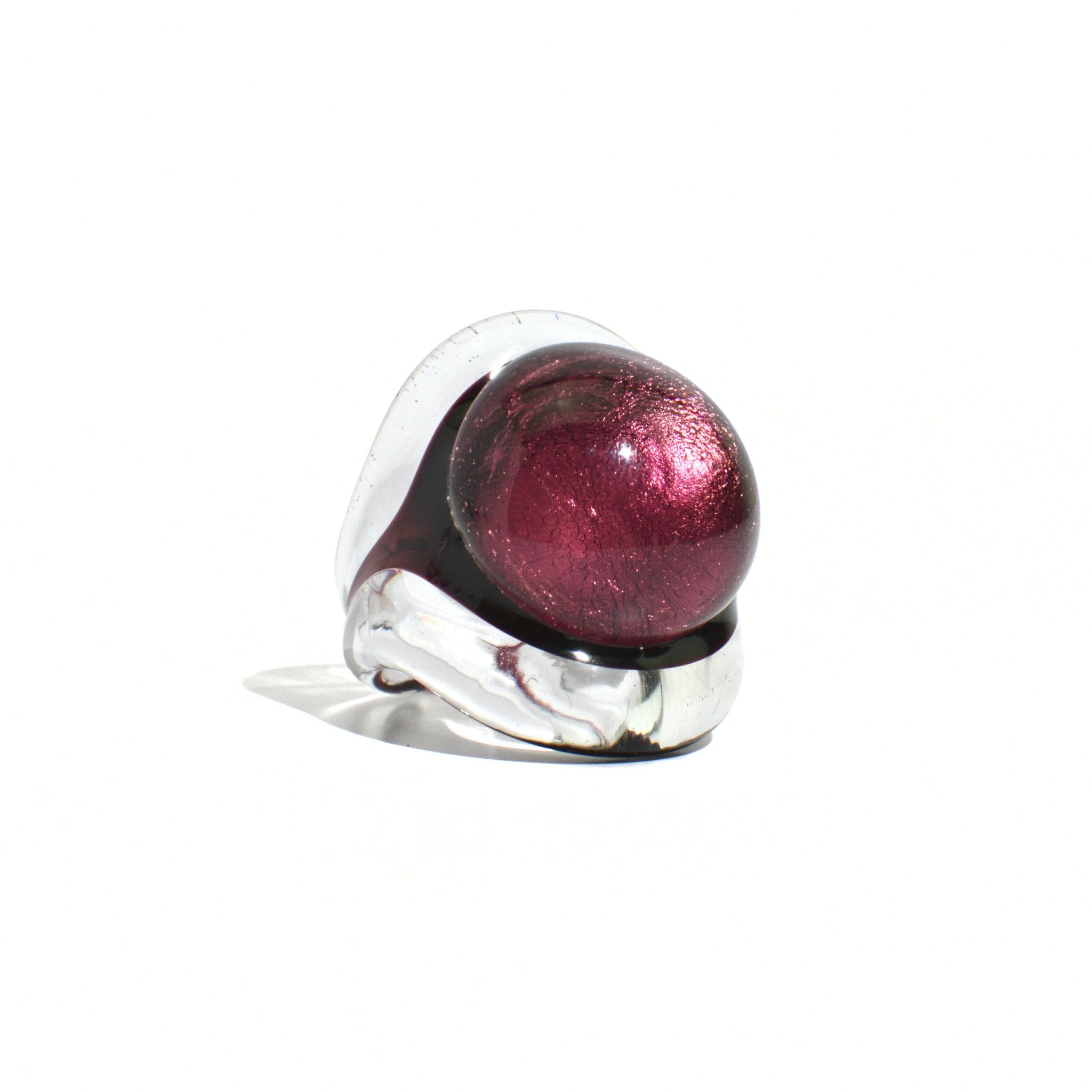 Close-up of a violet Murano Glass Occhio statement ring by MyItalianDecor, showcasing intricate glasswork and vibrant color.