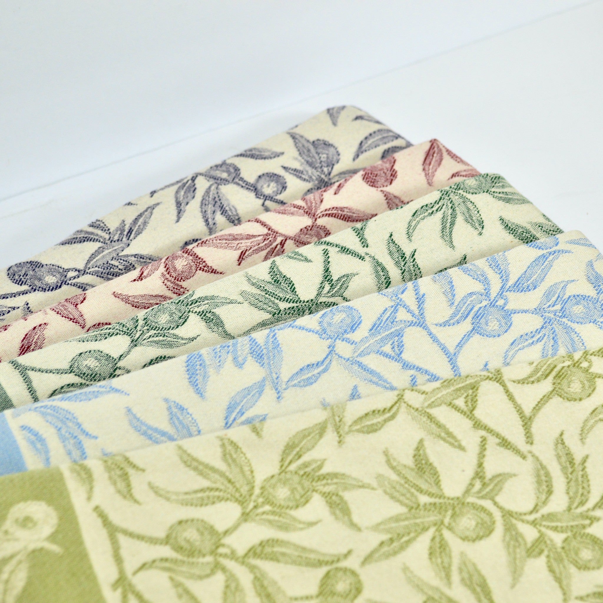 Colorful Busatti Oliva kitchen towel set from My Italian Decor, made in Italy, featuring vibrant assorted hues for stylish table linens.