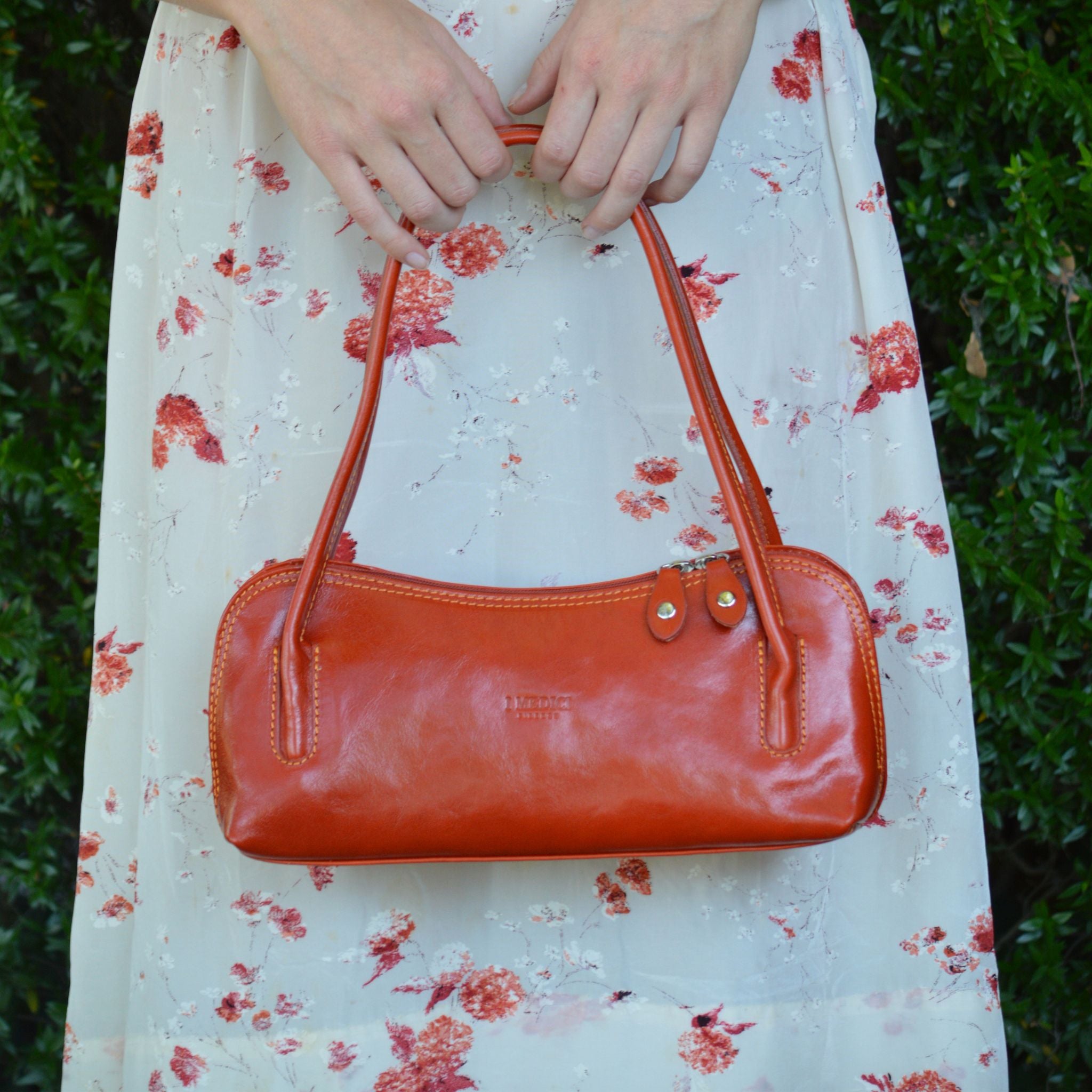 Orange Italian leather Carina shoulder bag from MyItalianDecor, stylish handbag with elegant design and detailed craftsmanship.
