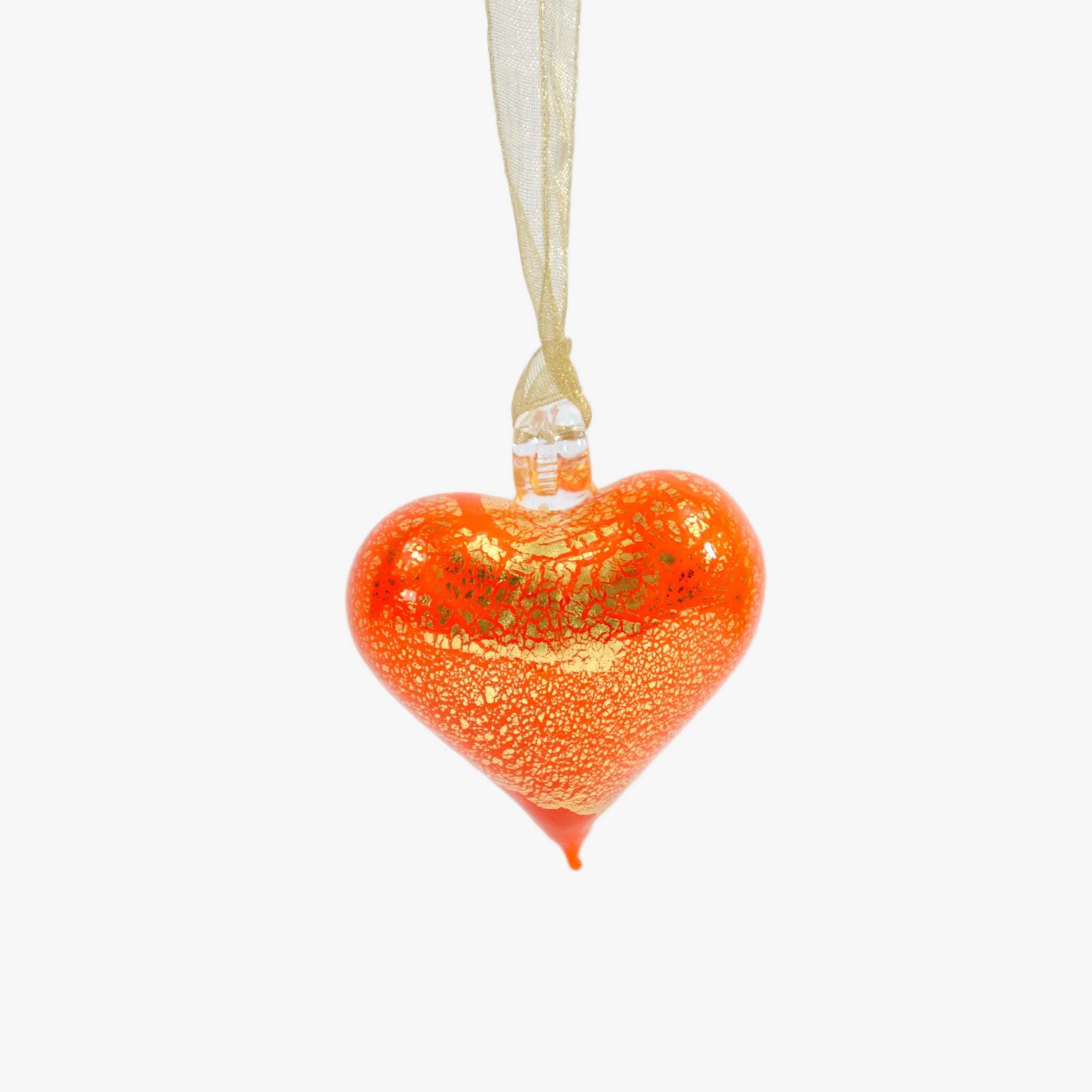 Small Murano glass heart ornament in orange, handmade in Italy, perfect as a colorful holiday decoration.