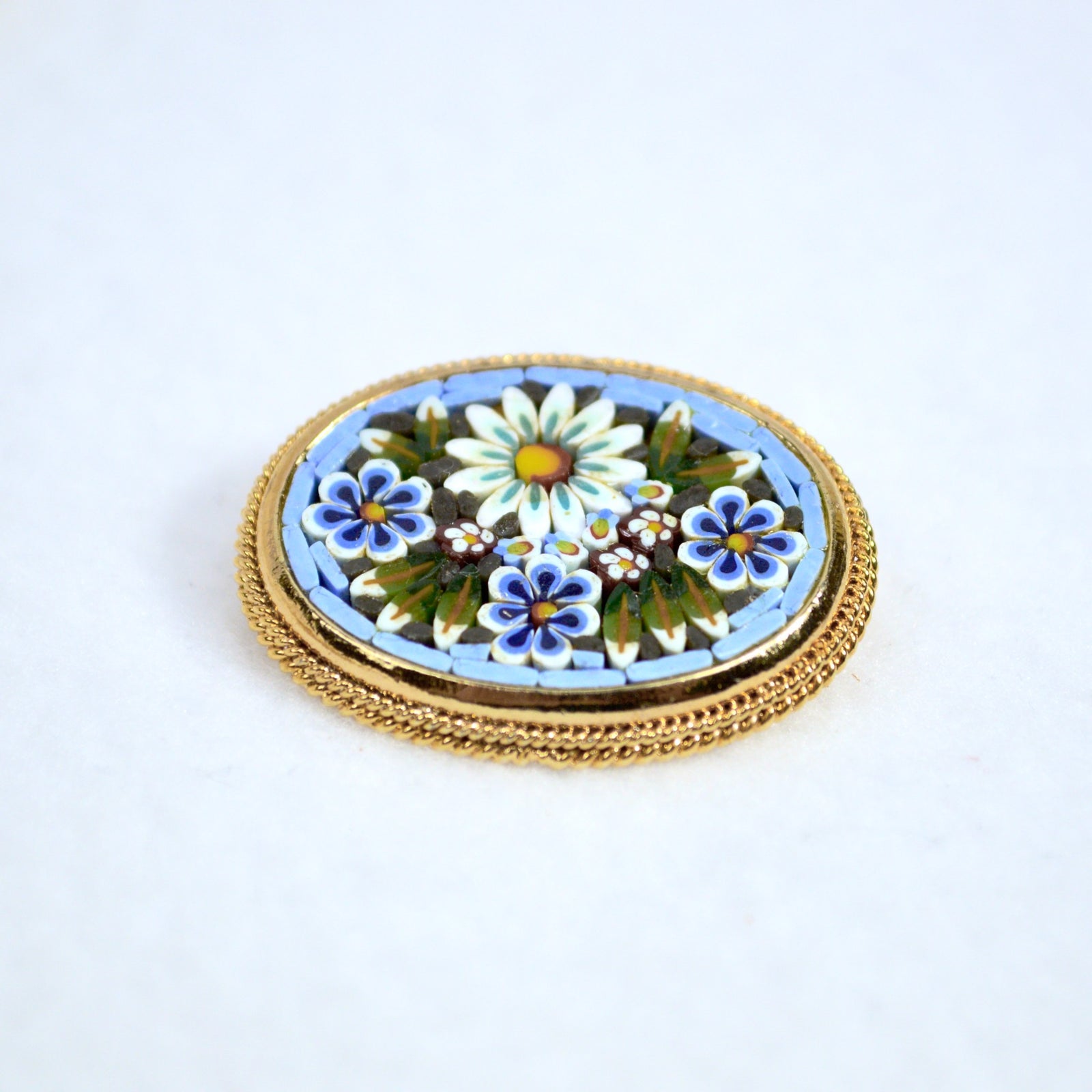 Colorful Florentine mosaic oval brooch lapel pin by My Italian Decor, made in Italy, featuring intricate mosaic design.