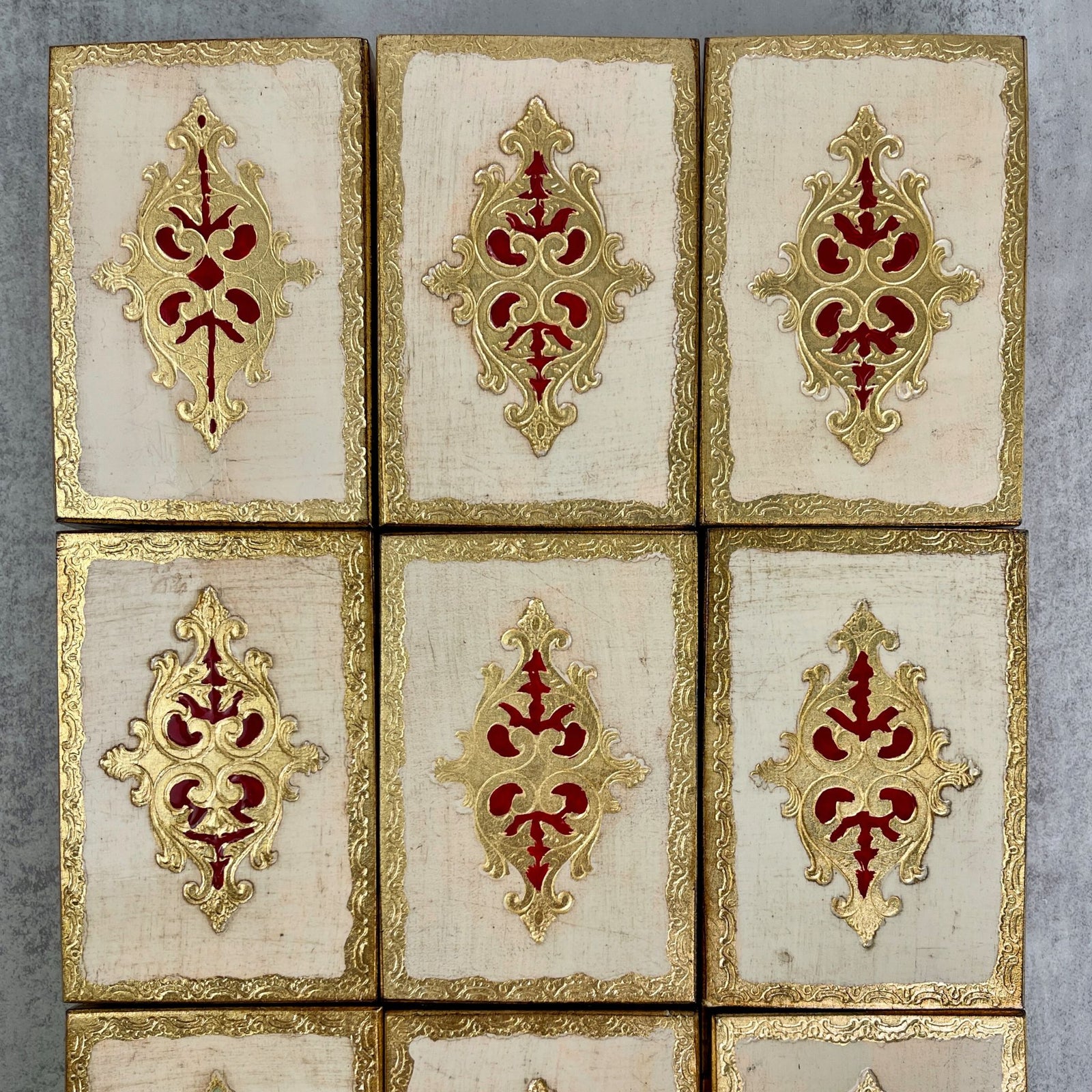 Red Florentine wood jewelry box with intricate patterns, featuring compartments for organizing jewelry, by My Italian Decor.