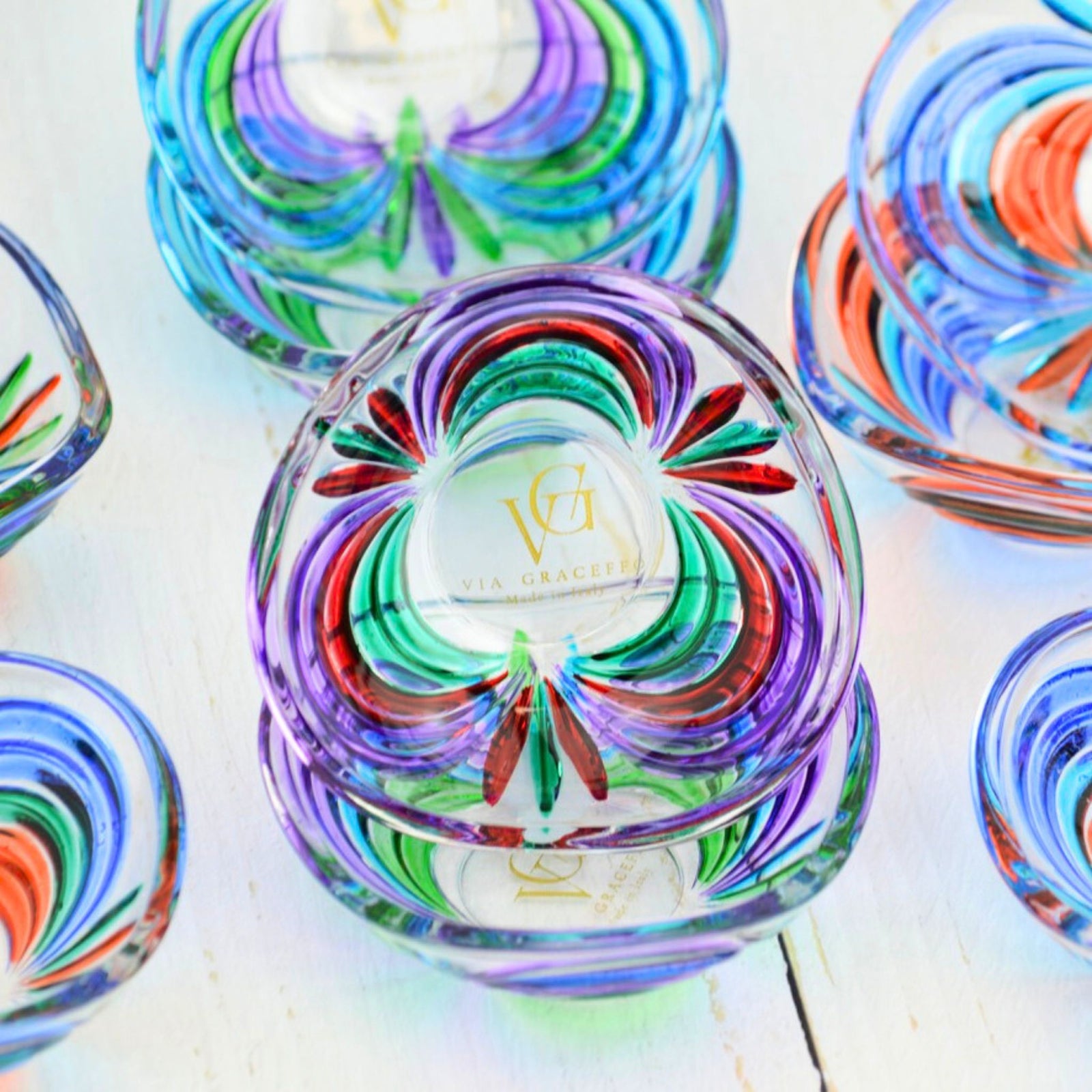 Colorful Venetian glass mini dish with rainbow design, decorative bowl by DZ, perfect for display or serving small items.