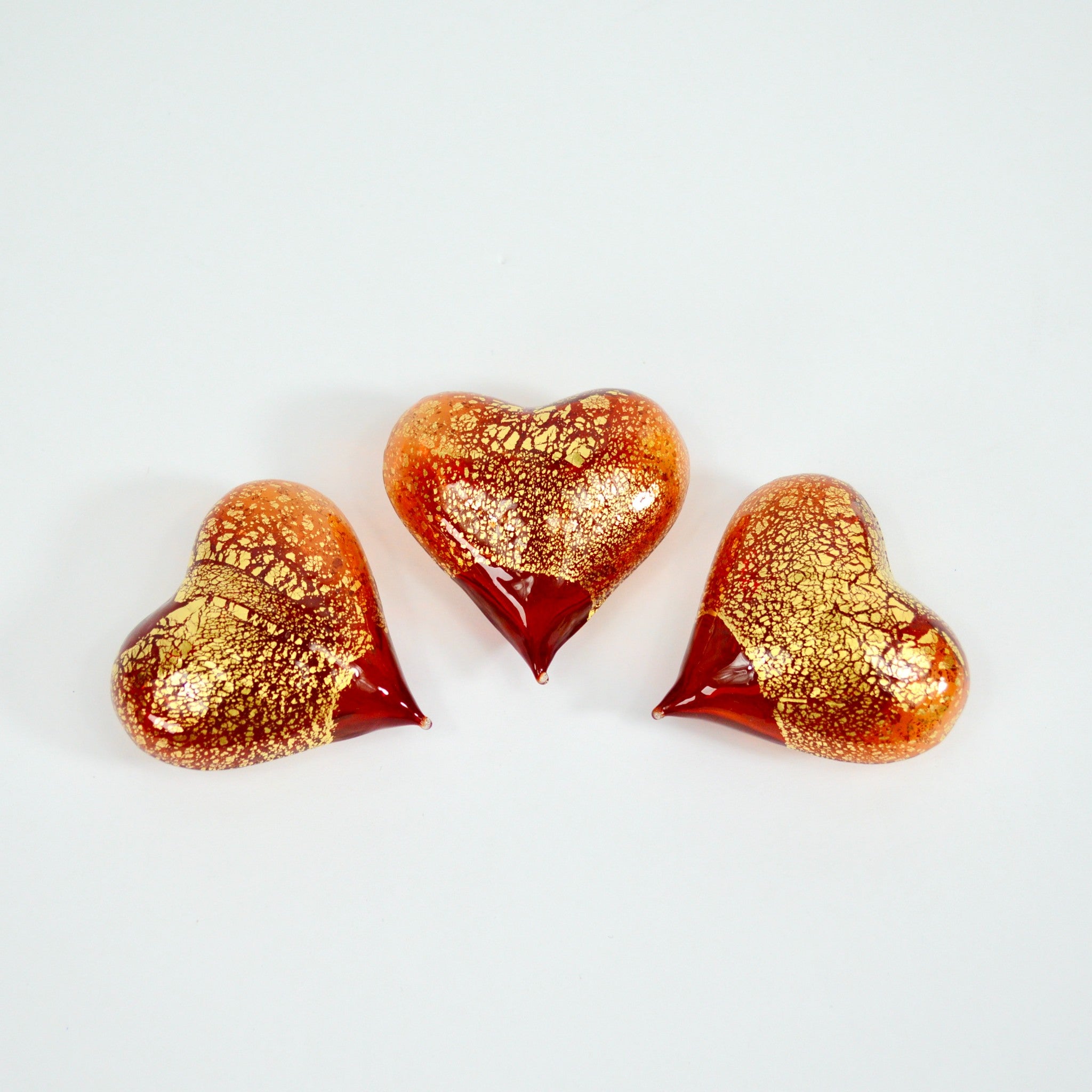 Set of three small Murano Glass Hearts figurines in red and transparent colors, handcrafted in Italy by MyItalianDecor.