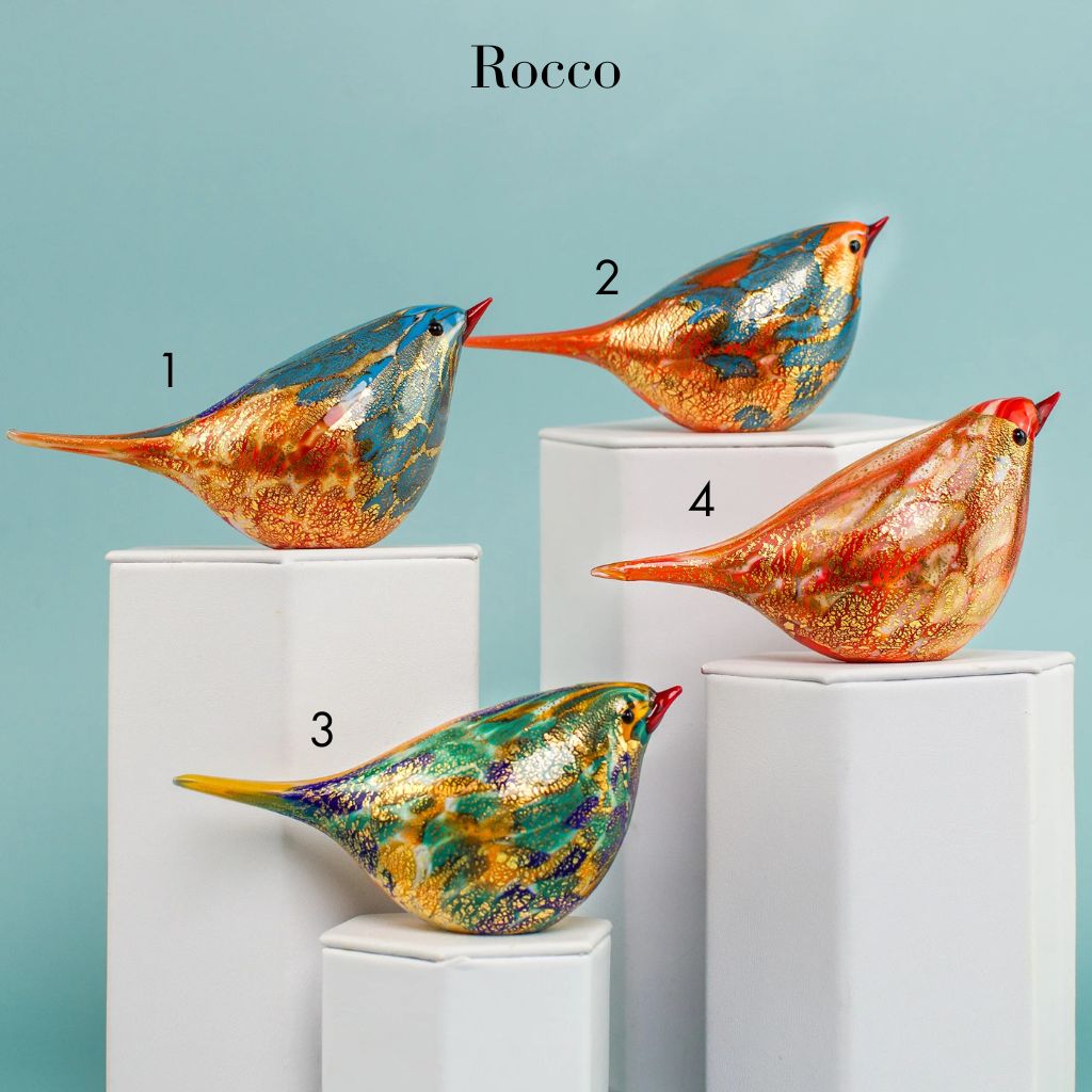 Murano glass handblown Chirpie bird figurine in orange and teal colors by Rocco, showcasing intricate craftsmanship and vibrant glasswork.
