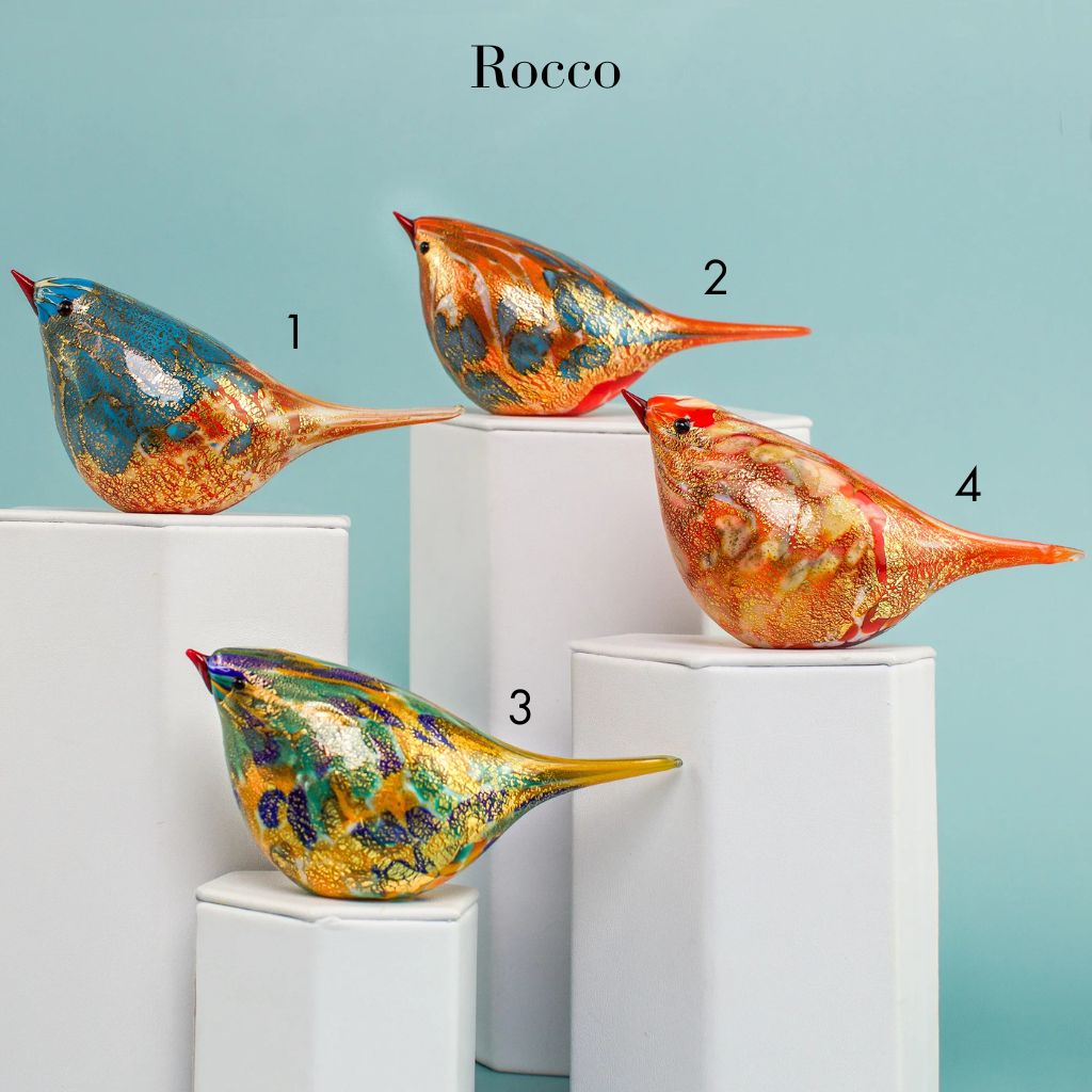 Handblown Murano glass Chirpie bird figurine in orange and teal by Rocco, showcasing vibrant colors and intricate craftsmanship.