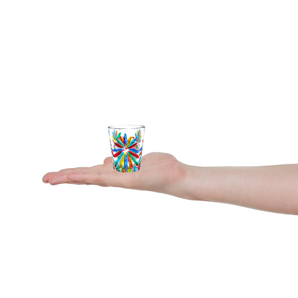 Set of 6 Italian crystal shot glasses with starburst design, made in Italy, featuring hand-held scale for size reference.