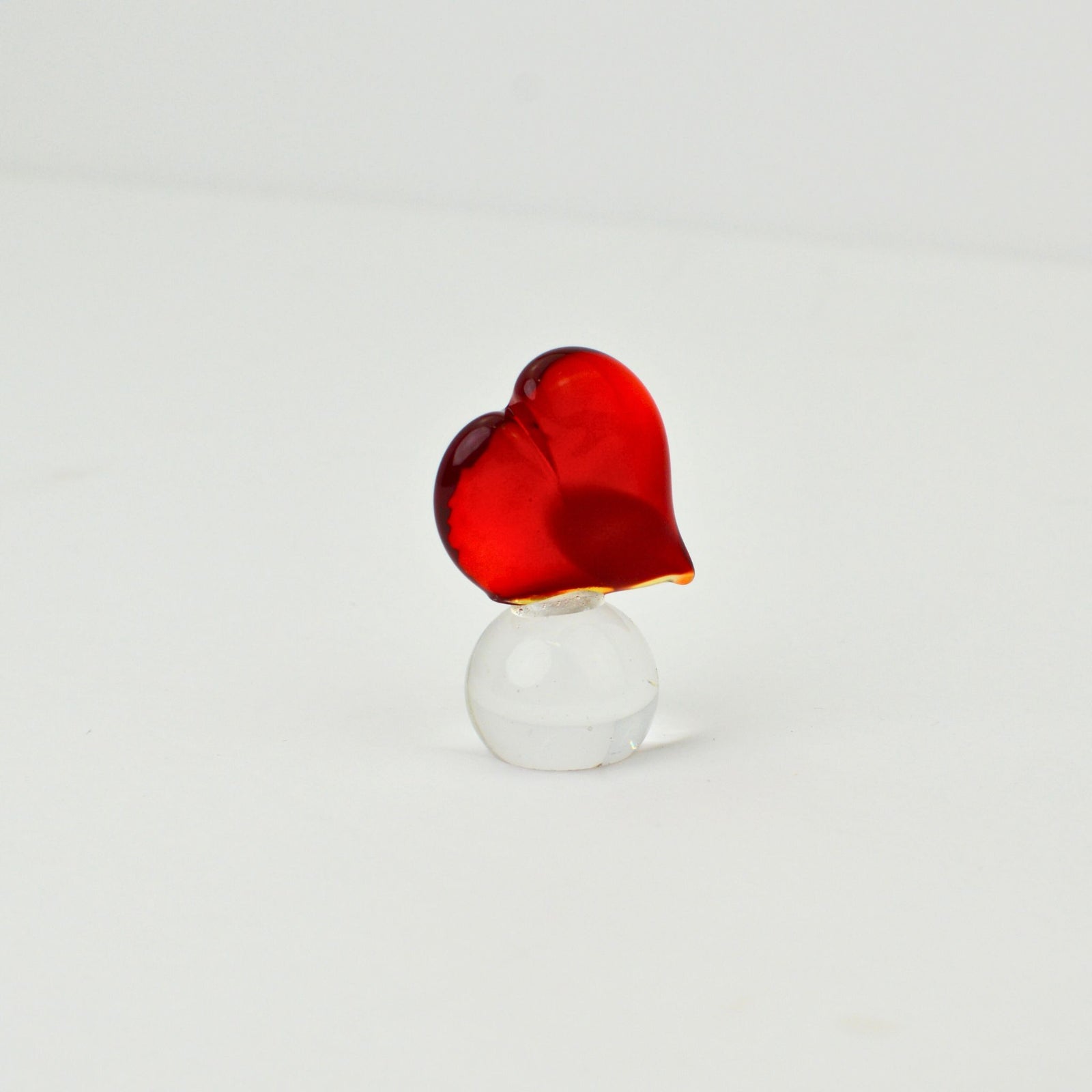Red Murano glass heart sculpture on a clear glass sphere, decorative figurine by MyItalianDecor.