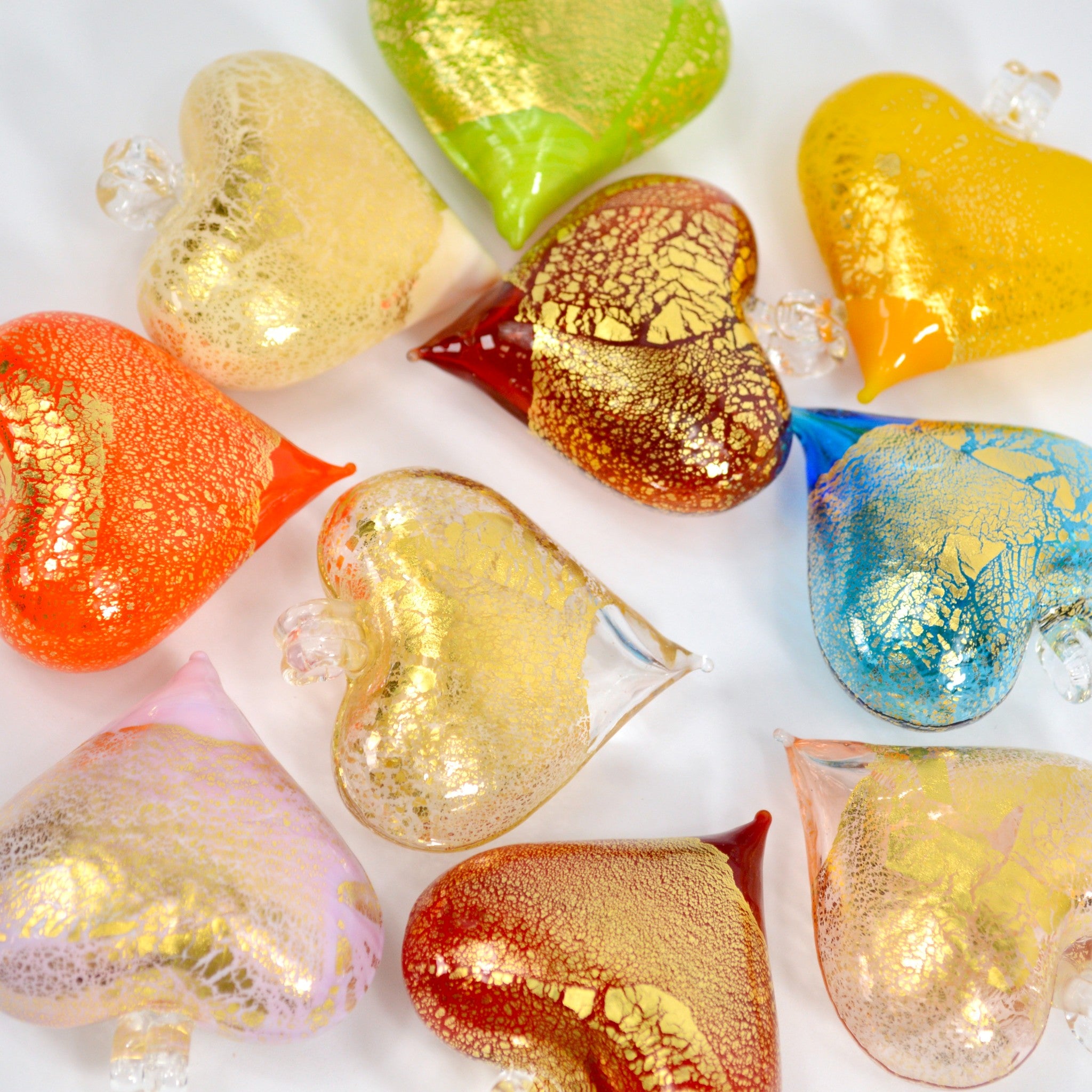 Colorful Murano Glass small heart ornament hanging, handcrafted in Italy, ideal for holiday decor and gift-giving.