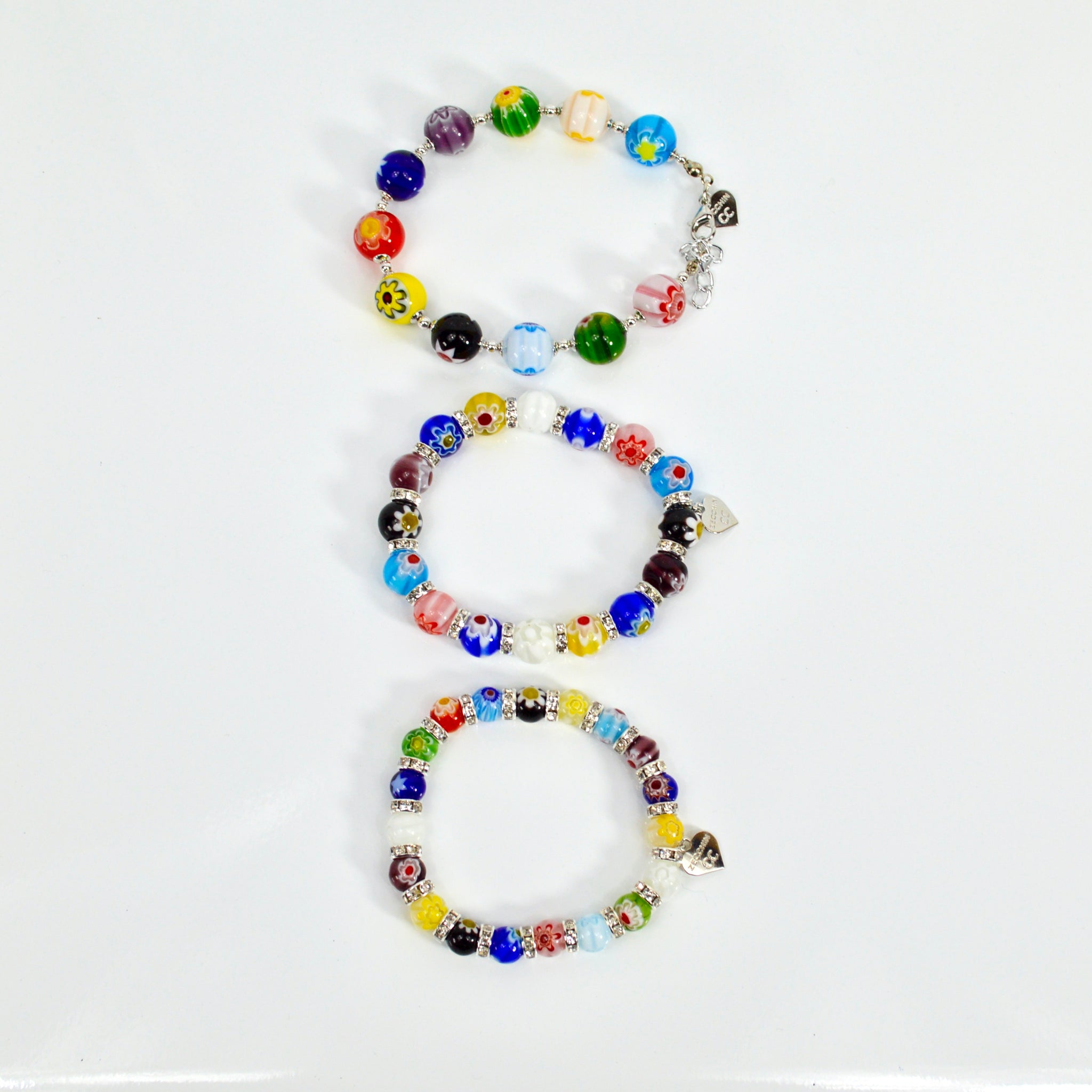 Colorful Murano Glass Millefiori bead elastic bracelet from Italy, featuring vibrant, patterned glass beads on a stretch cord.