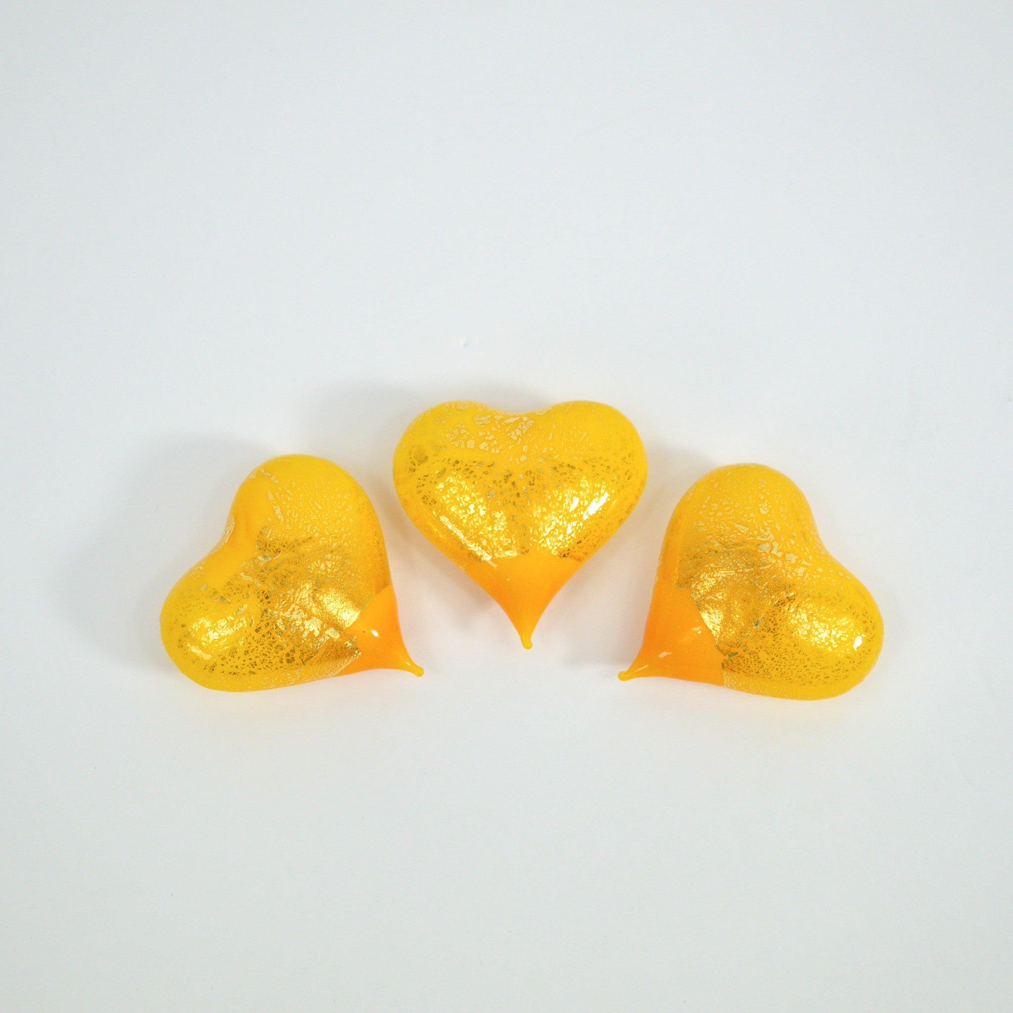 Set of three small Murano glass hearts in yellow, red, and blue, handmade Italian figurines by MyItalianDecor.
