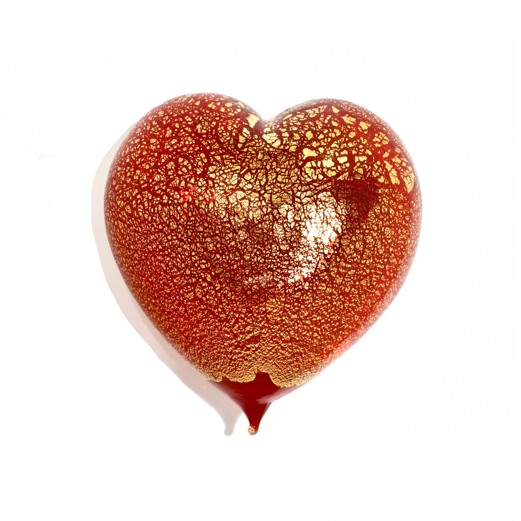 Red Murano glass heart figurine with 24-karat gold accents, made in Italy, showcasing vibrant color and craftsmanship.