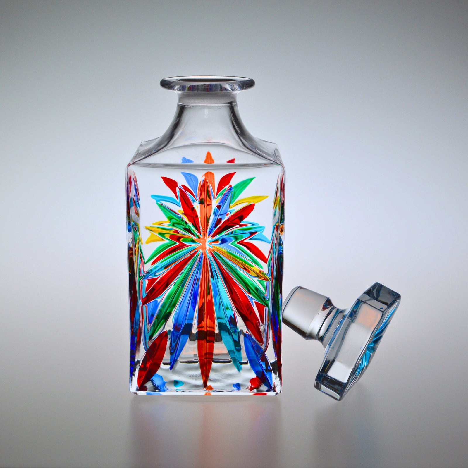 DZ Starburst Decanter made of hand-painted crystal, quarter view showing intricate design and elegant craftsmanship.