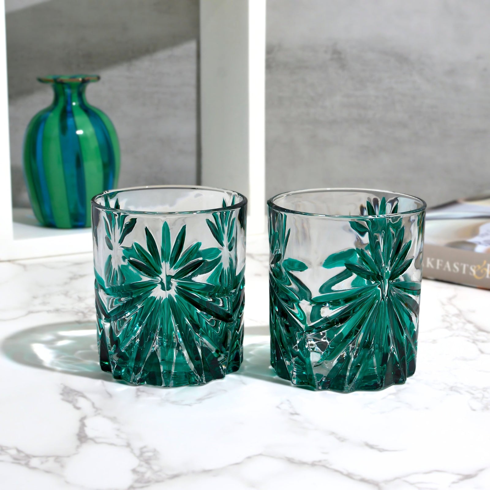 DZ Starburst short drink glasses, hand-painted emerald green Italian crystal tumblers held on a tray.
