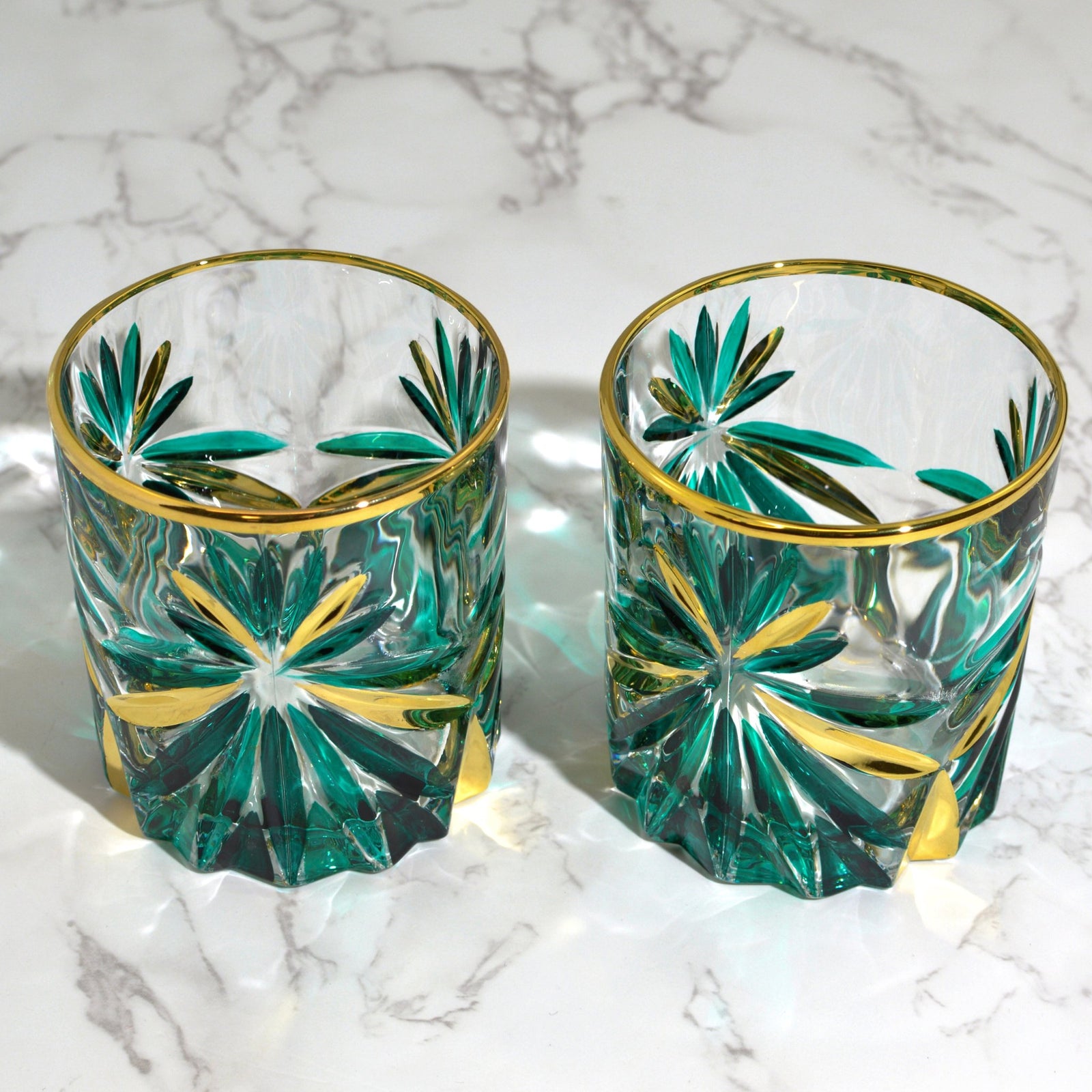 Starburst green and gold Italian crystal decanter with matching drink glasses by DZ, showcasing intricate design and elegant craftsmanship.