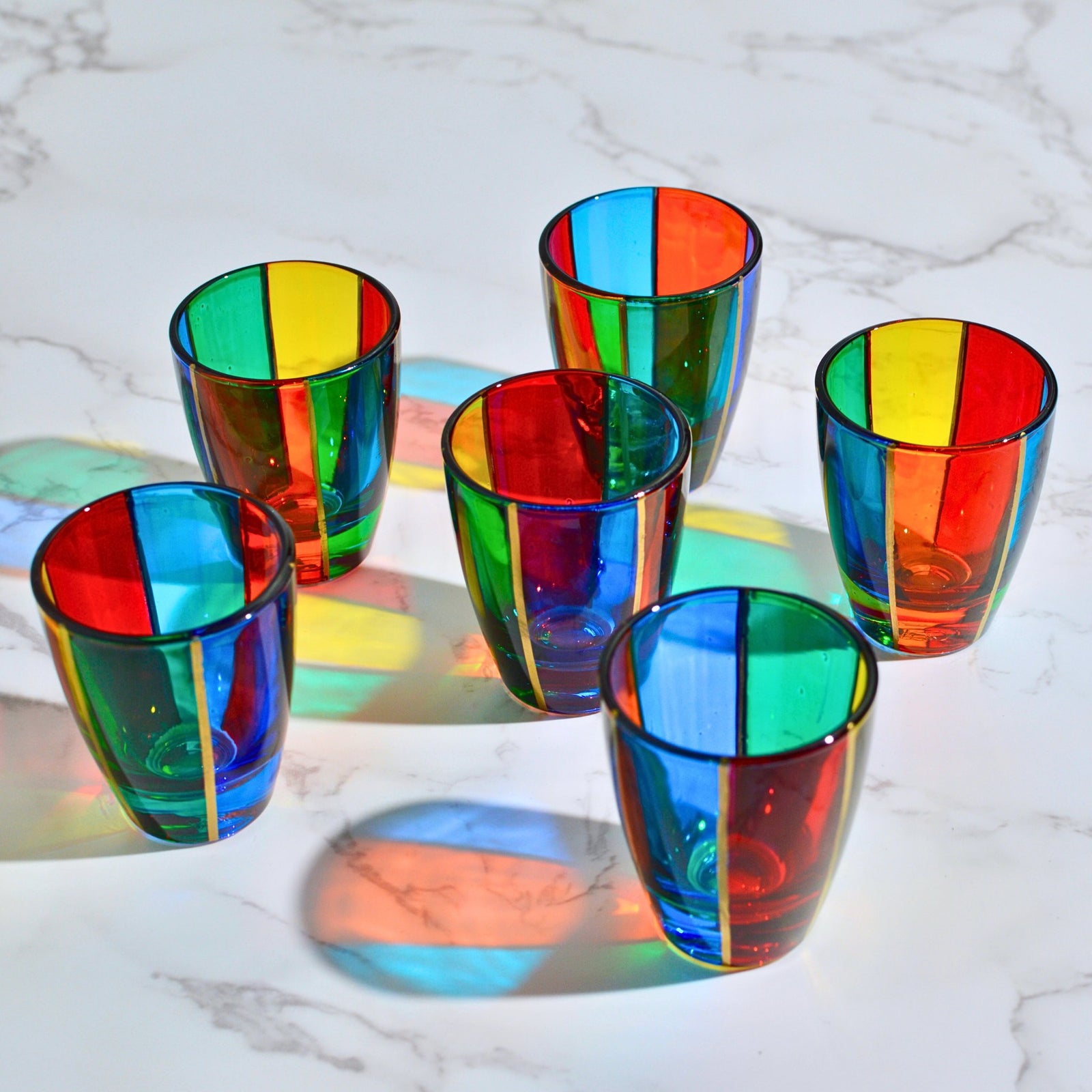Set of 6 colorful hand-painted crystal shot glasses by MyItalianDecor, featuring vibrant shadows and Italian craftsmanship.