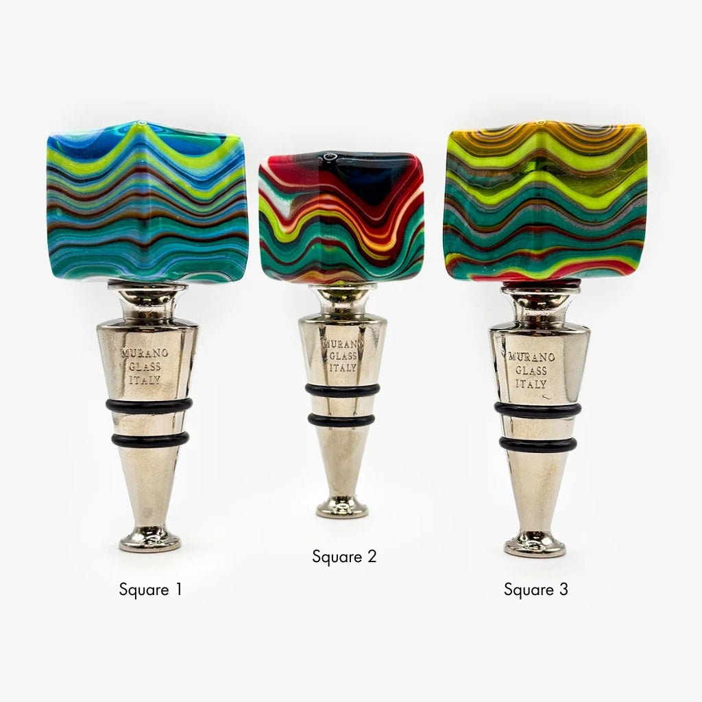 Three square-shaped glass stoppers with colorful marbled swirl patterns and silver-toned metal bases, labeled Square 1, Square 2, and Square 3 on a light gray background.