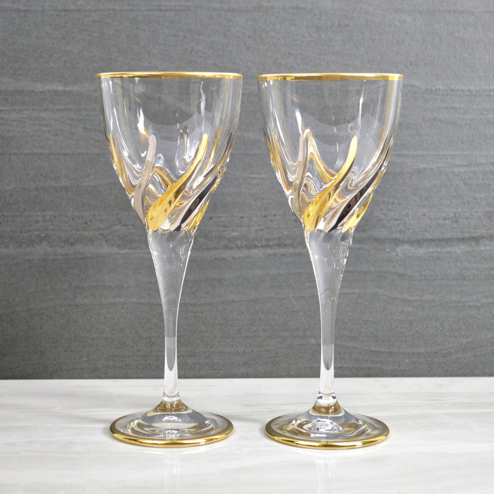Set of two Trix wine glasses by MyItalianDecor featuring platinum and gold accents, elegant glassware for wine drinking.