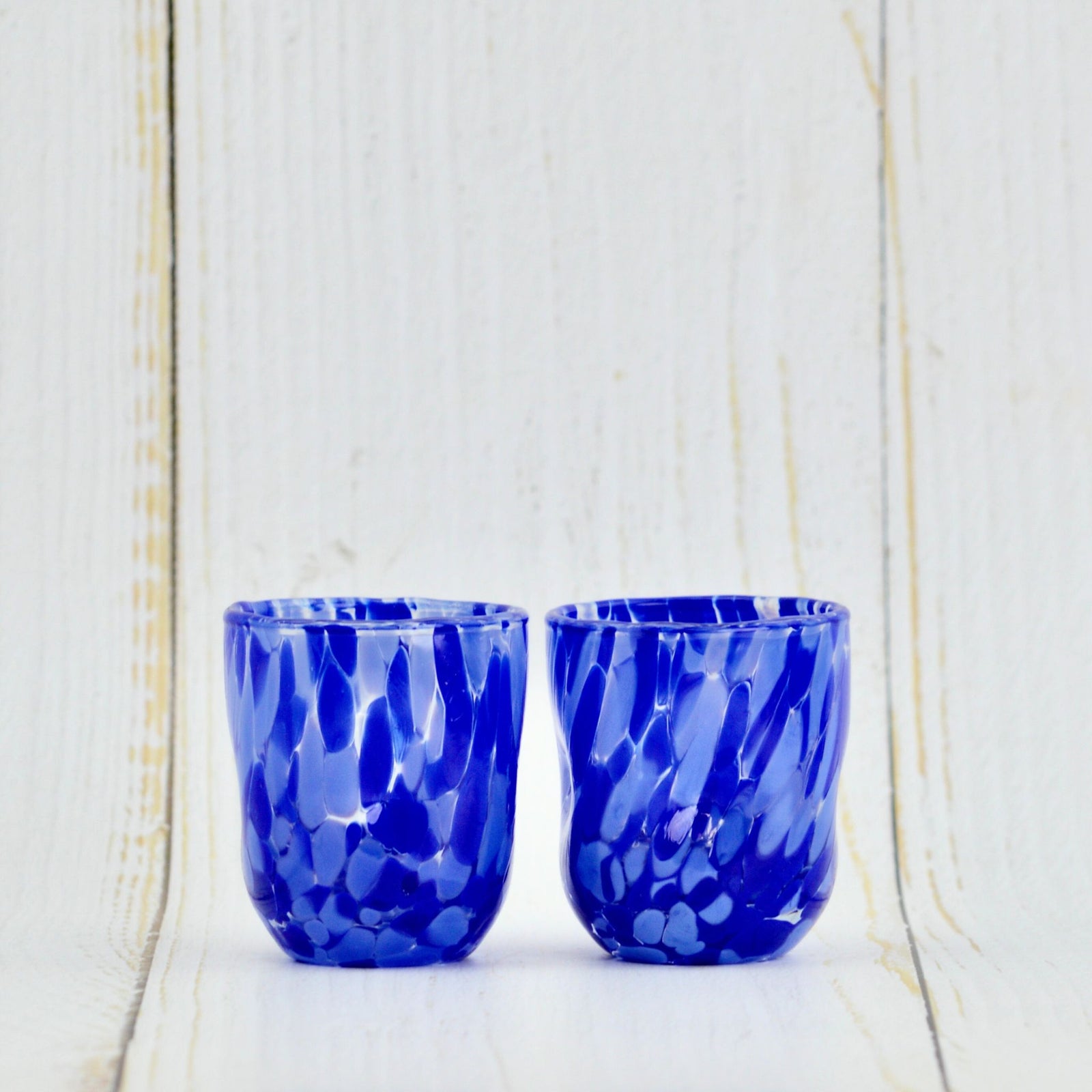 Set of Murano Glass Viva shot glasses by My Italian Decor, handcrafted Italian-made glassware with vibrant colors and intricate designs.