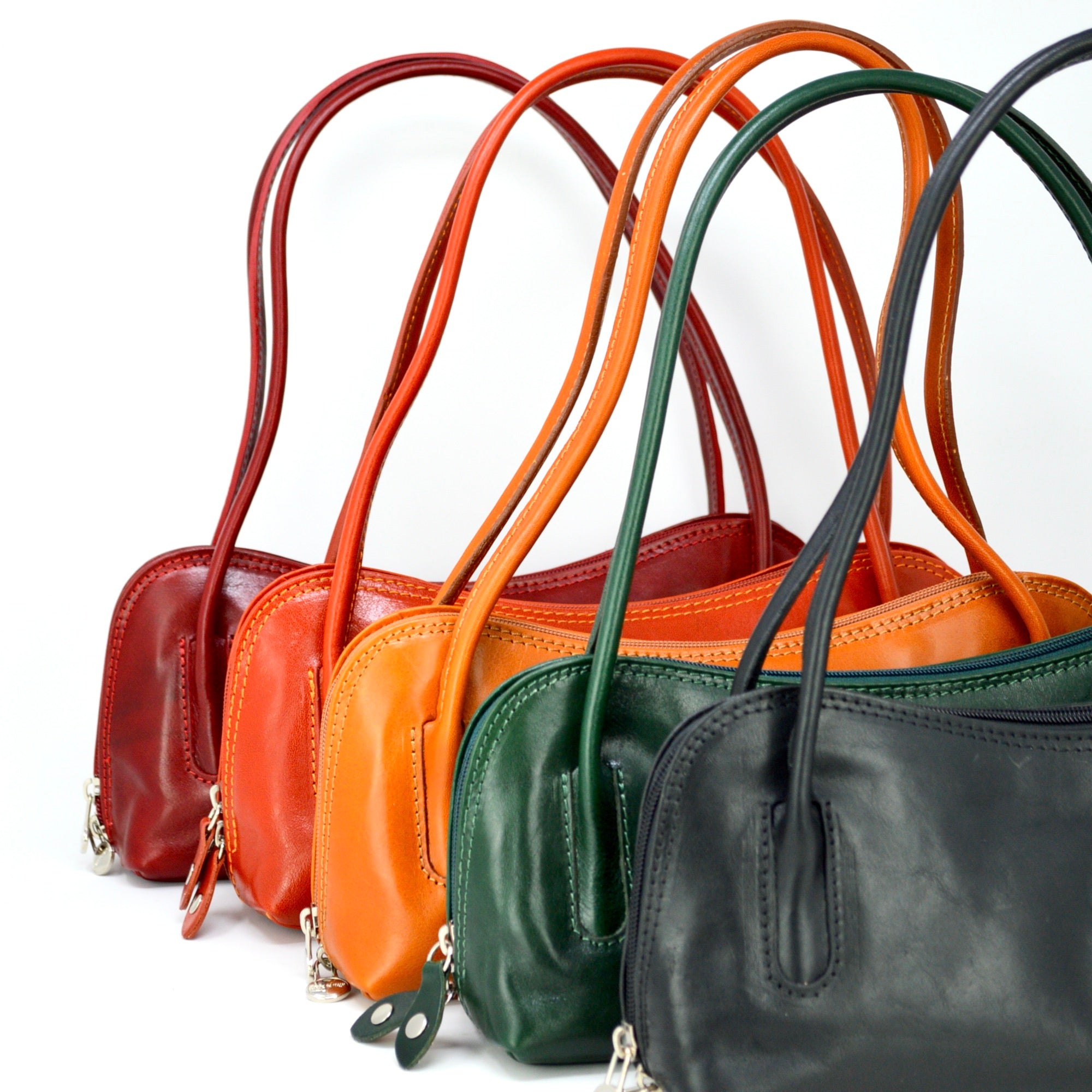 Carina Italian leather shoulder bag by MyItalianDecor displayed in various colors, featuring a sleek design and elegant craftsmanship.