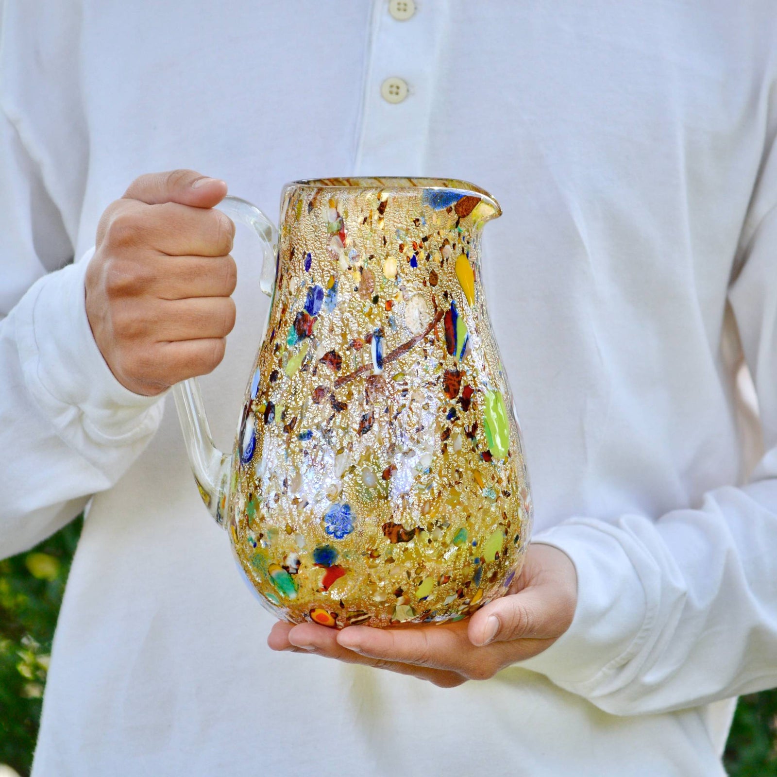 Amber Murano glass Alta round drink pitcher by DZ featuring colorful millefiori design for serving beverages.