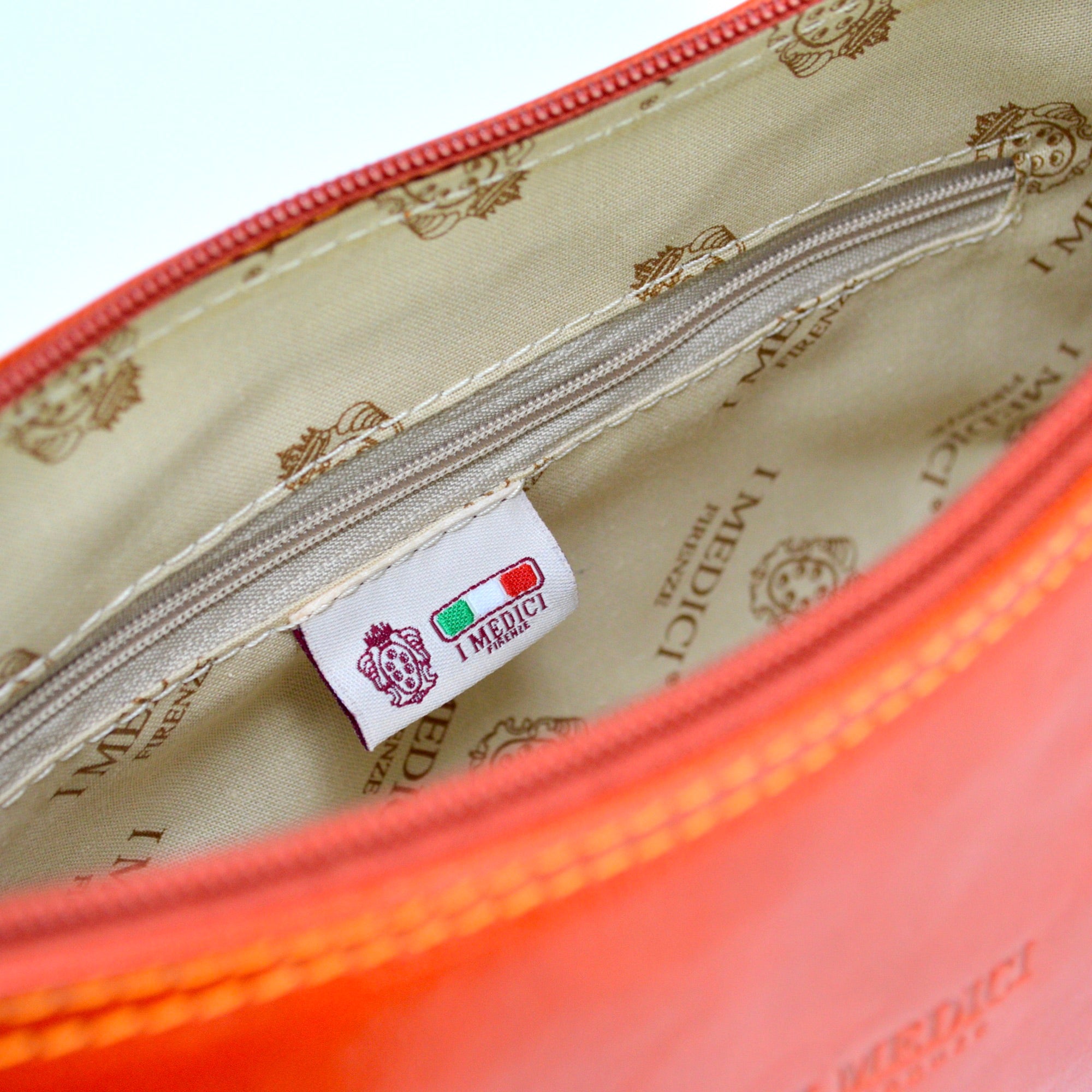 Carina shoulder bag made of orange Italian leather, stylish handbag with adjustable strap and elegant design.