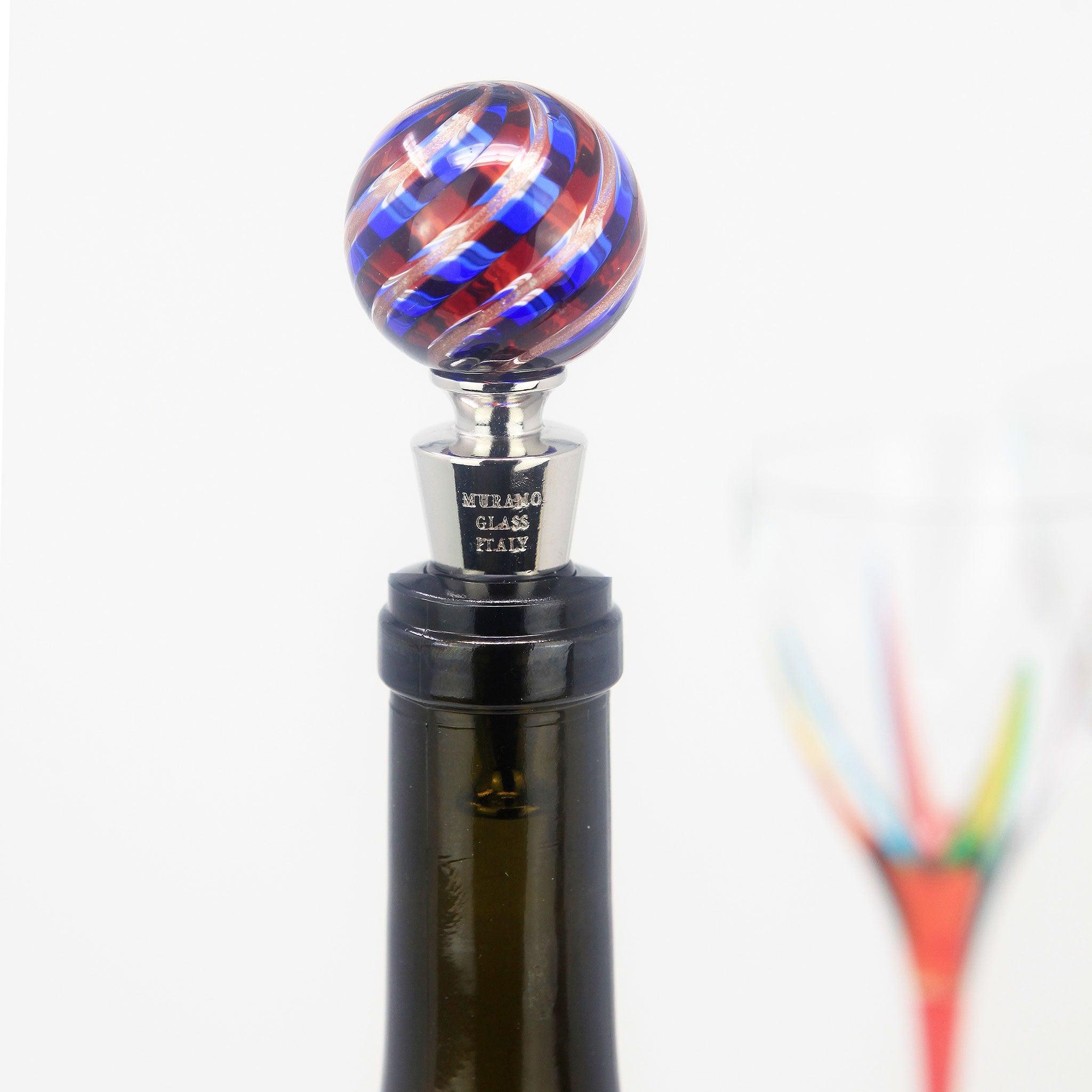 Closeup of Murano glass wine stopper in a bottle, showcasing colorful, handcrafted Italian glass art from MyItalianDecor.
