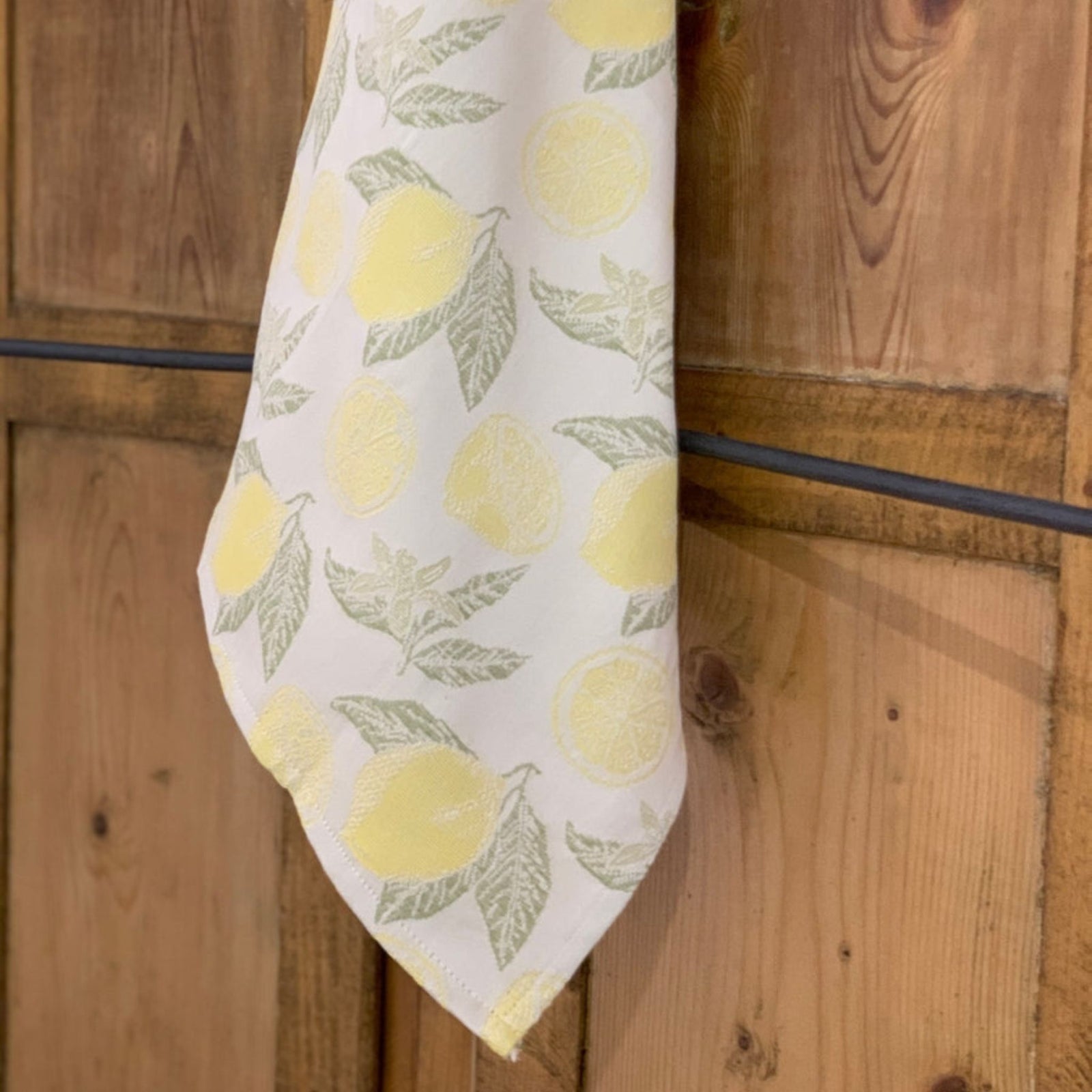 Busatti Lemon Kitchen Towel from My Italian Decor, made in Italy, featuring bright yellow lemon print on soft table linen fabric.